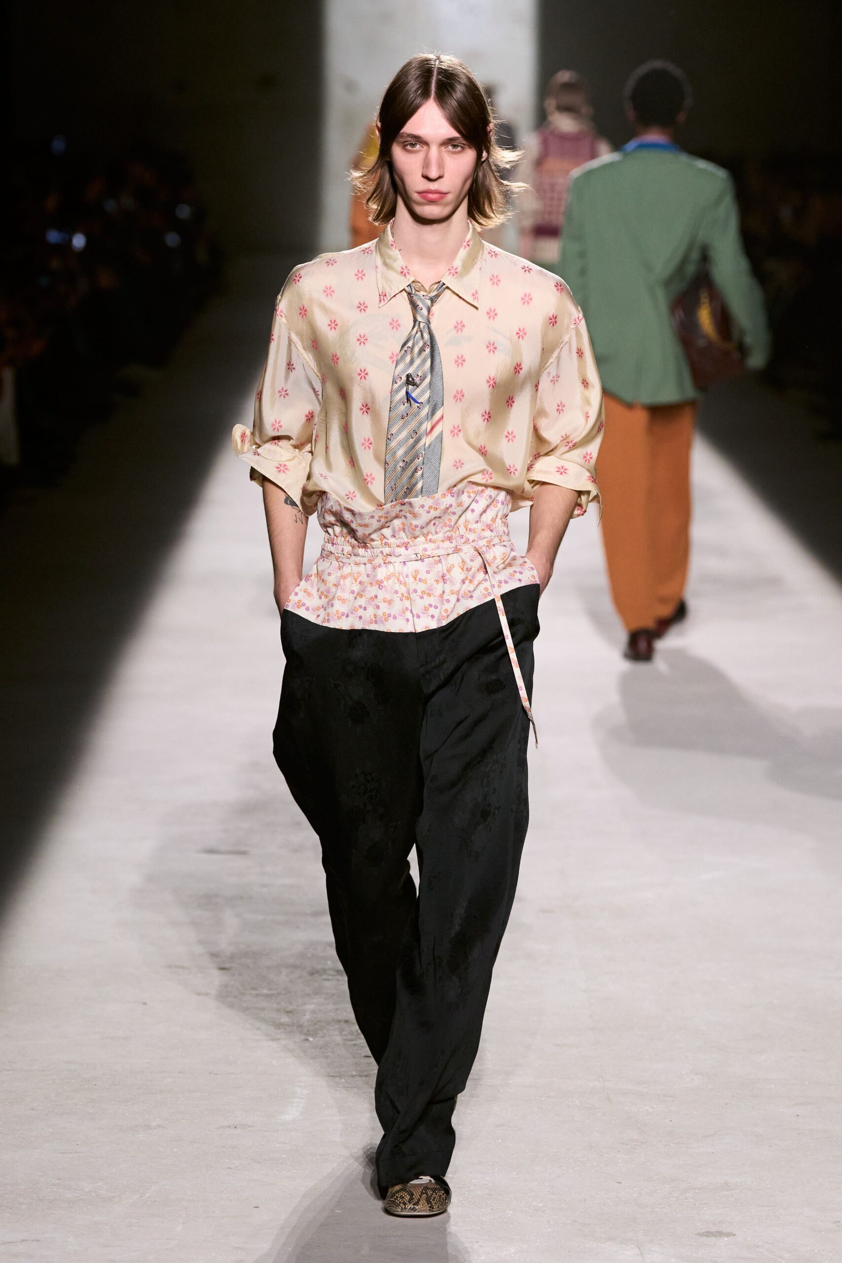 beige floral shirt black pants