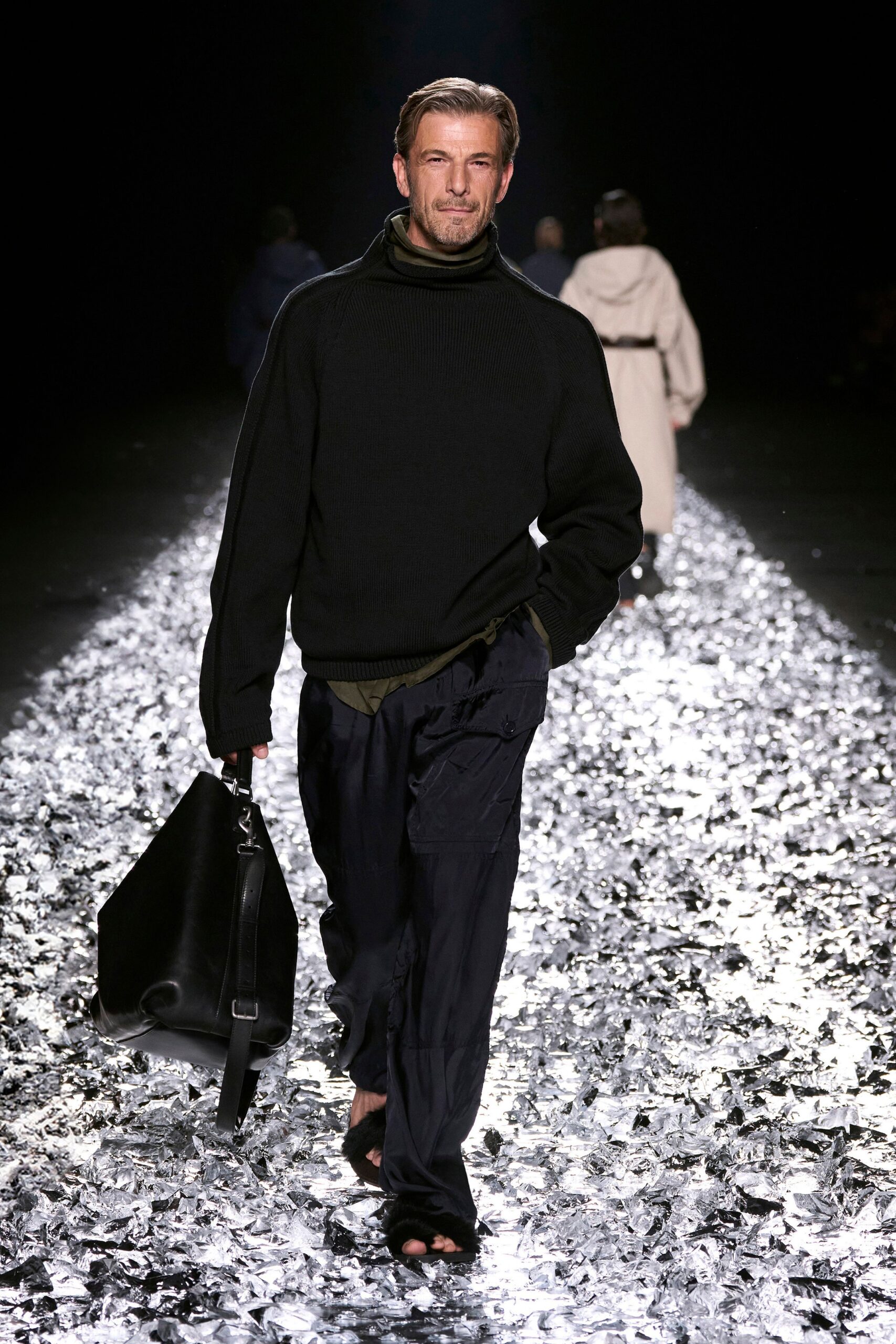 black wool sweater and navy cargo pants
