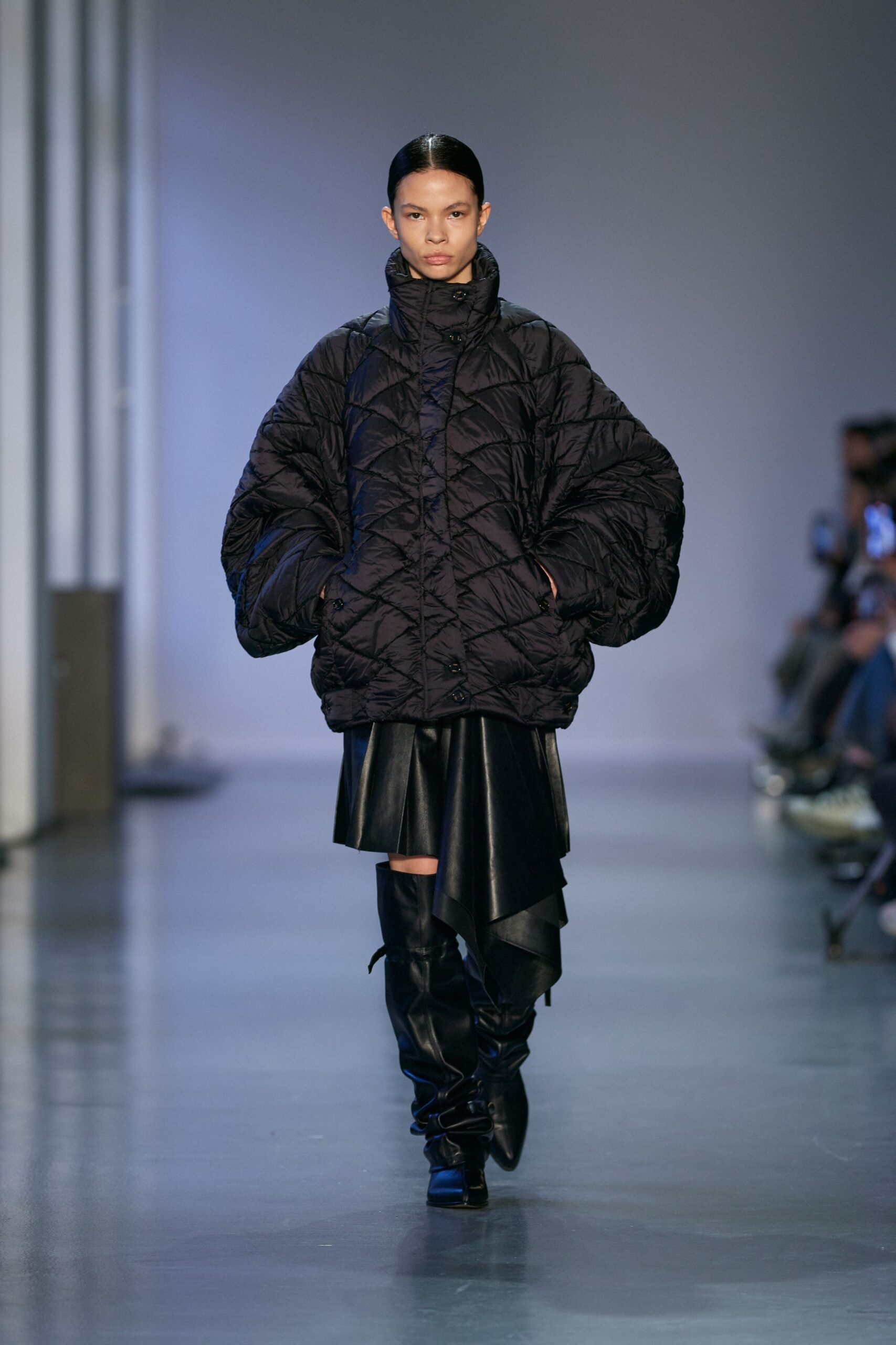 black oversized quilted jacket with leather skirt
