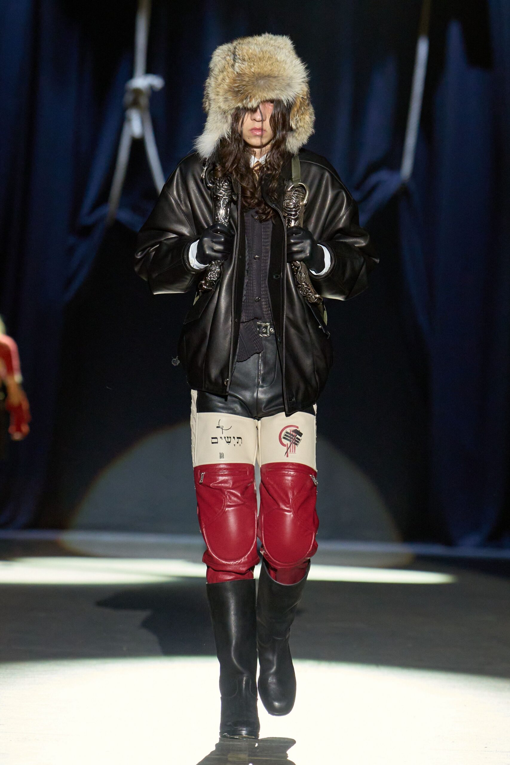 black leather jacket with beige fur hat