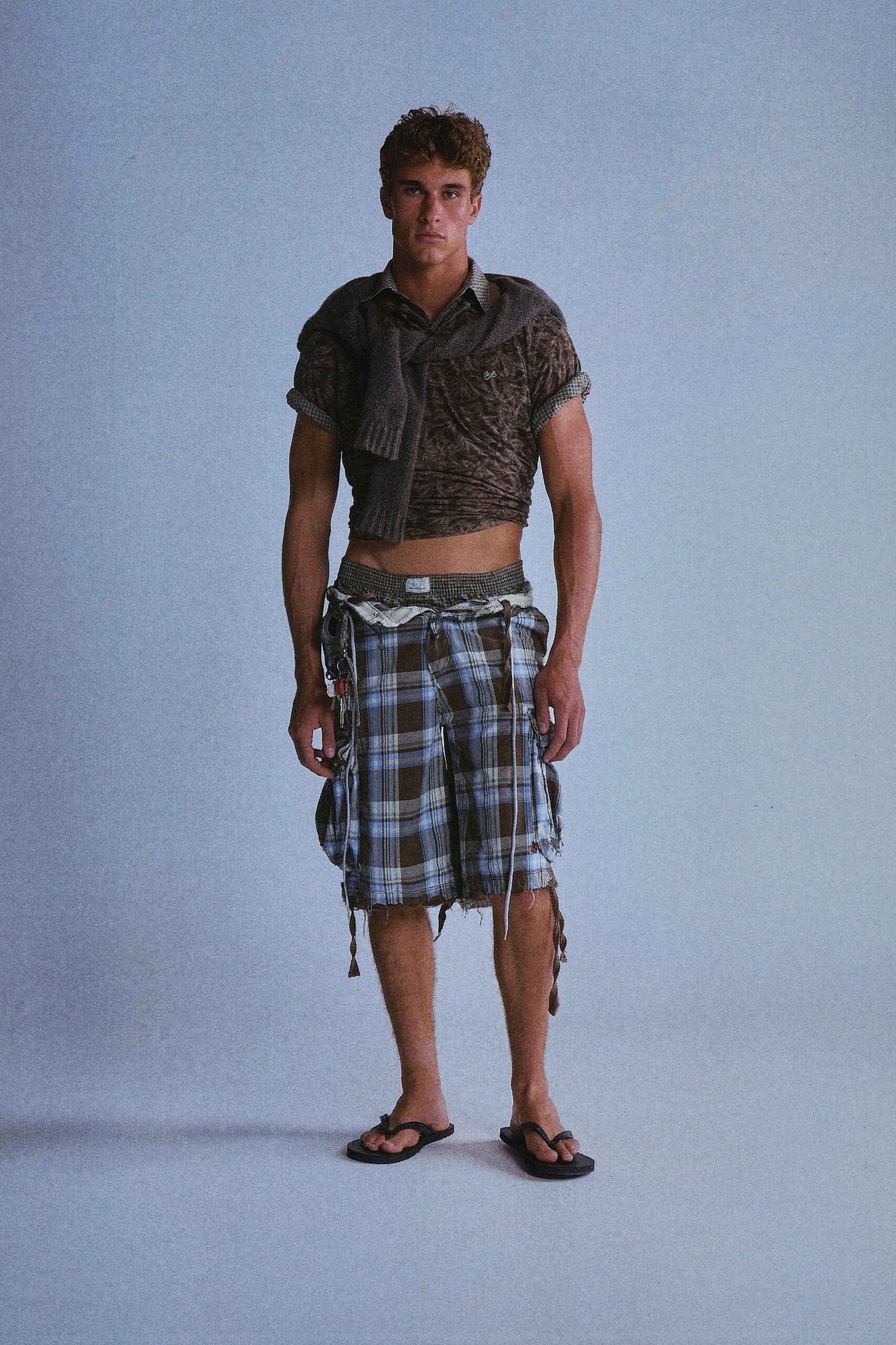 brown printed shirt with gray shorts