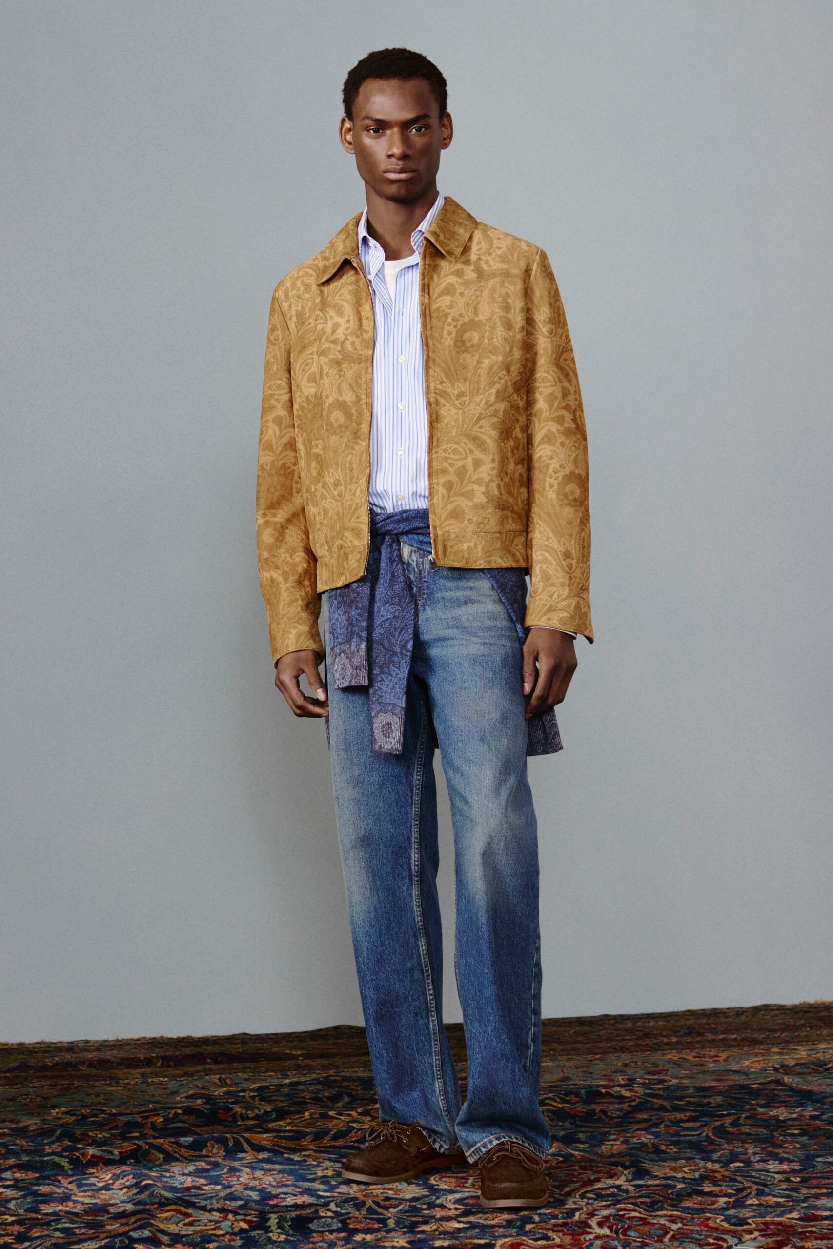 gold embroidered jacket with denim pants