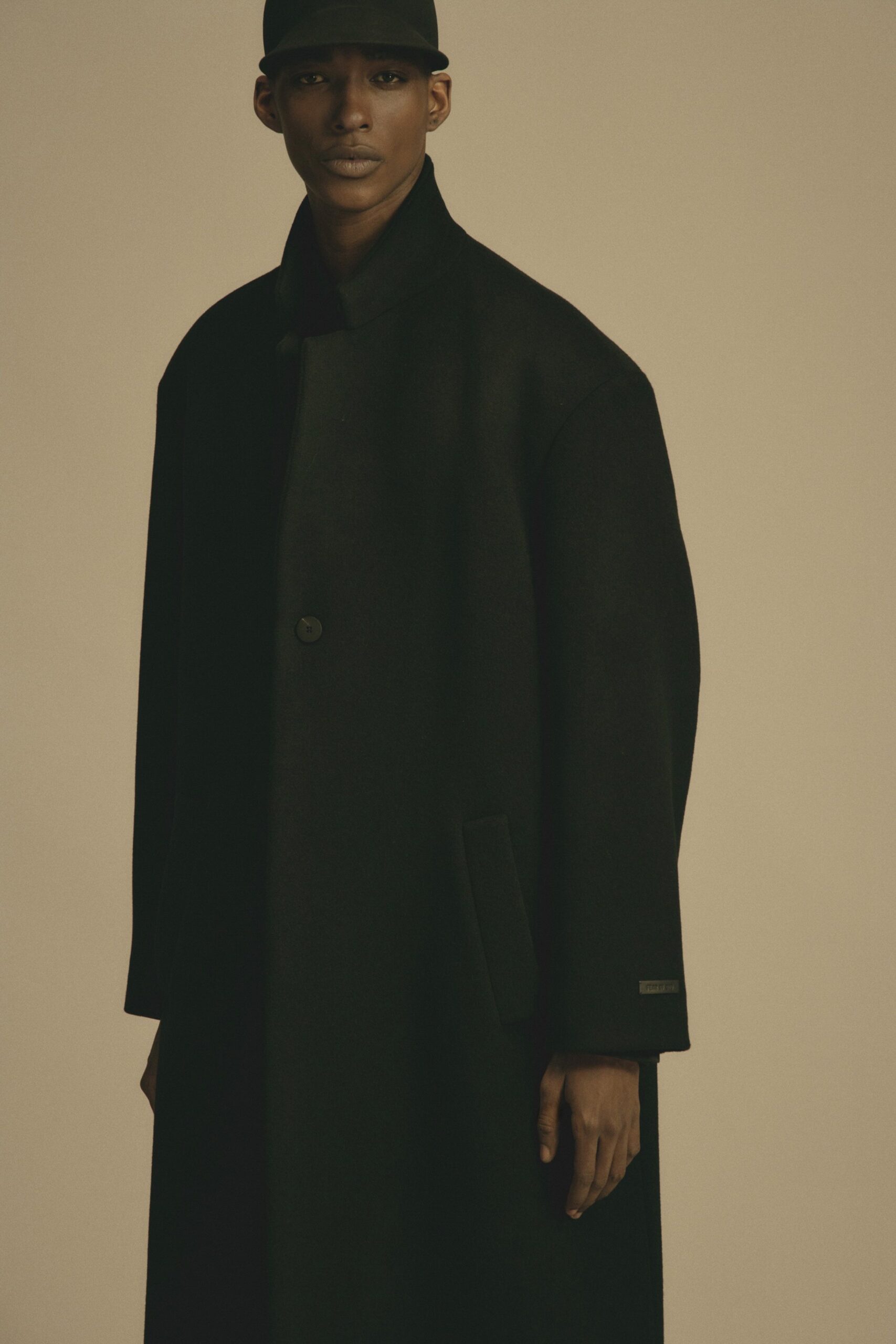 black oversized wool coat and hat