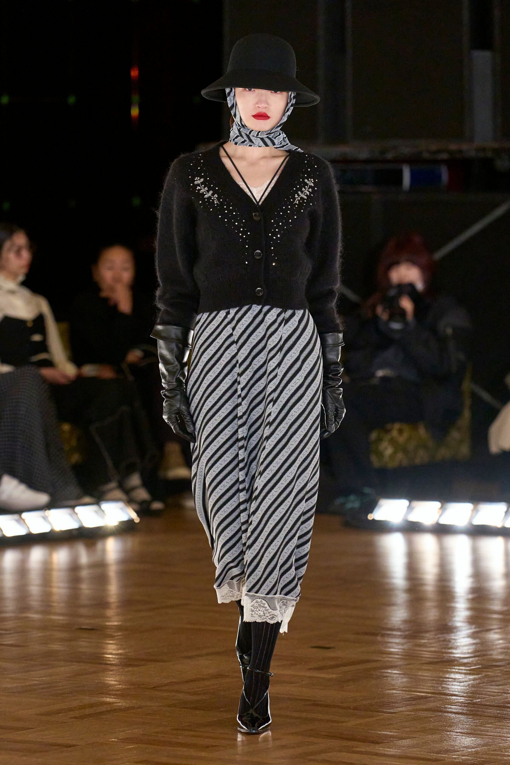 black wool cardigan with striped skirt