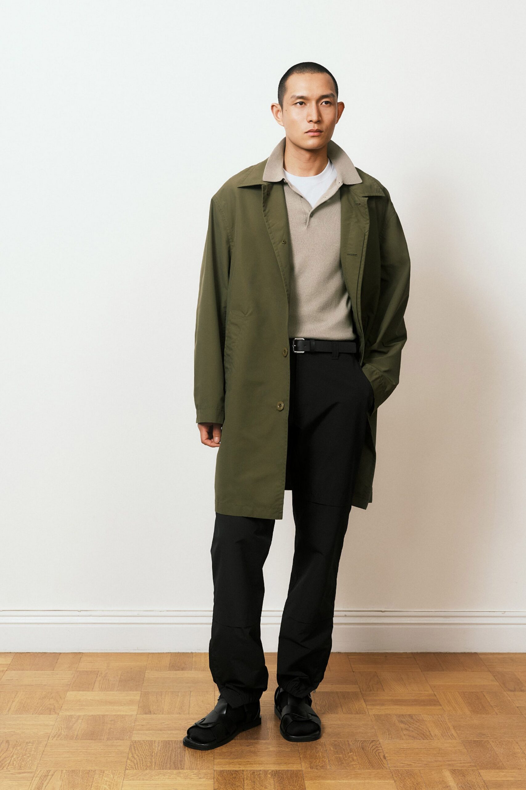 green coat gray top black pants