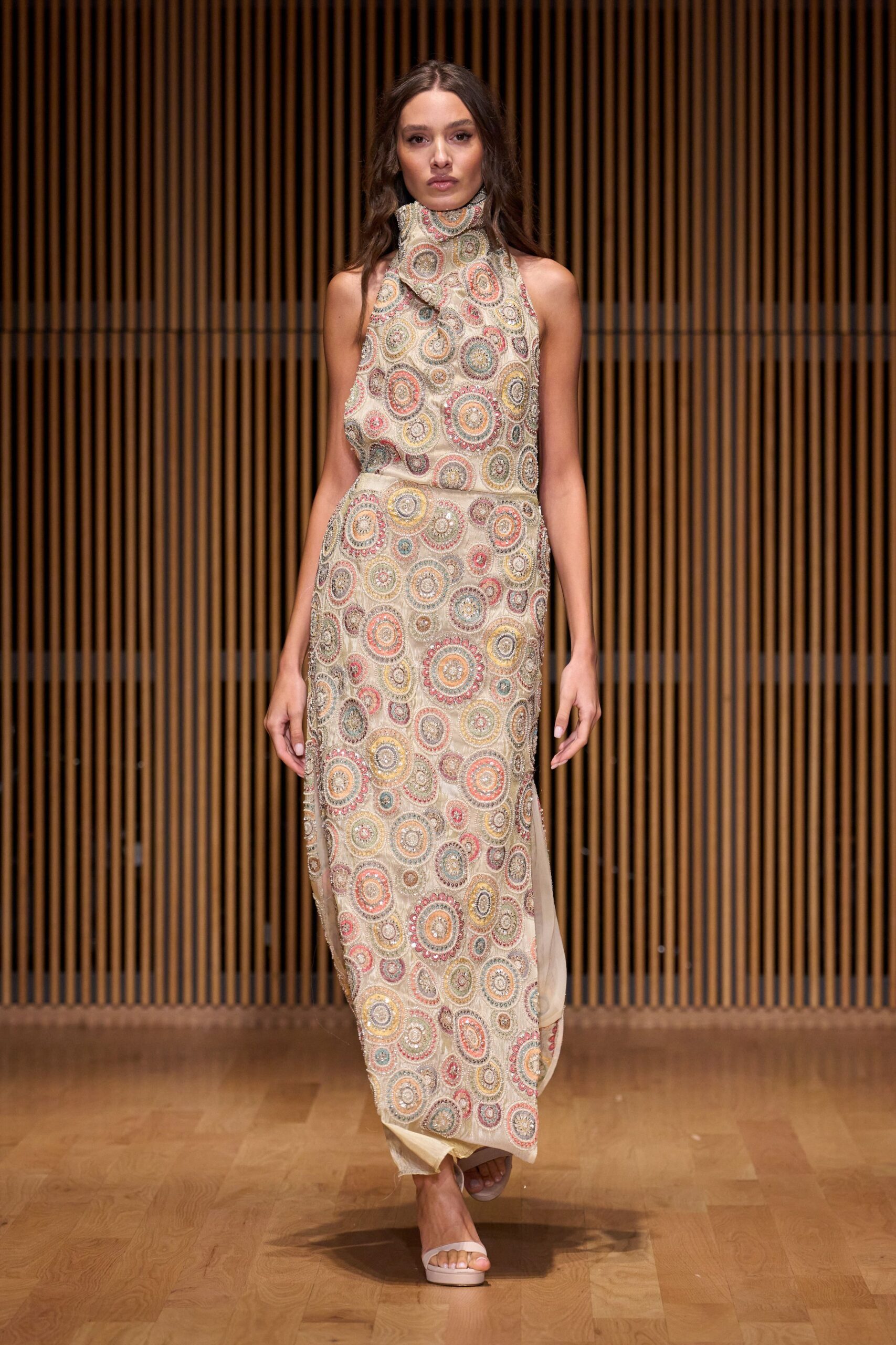 beige silk sleeveless high-neck fitted printed flowing gown