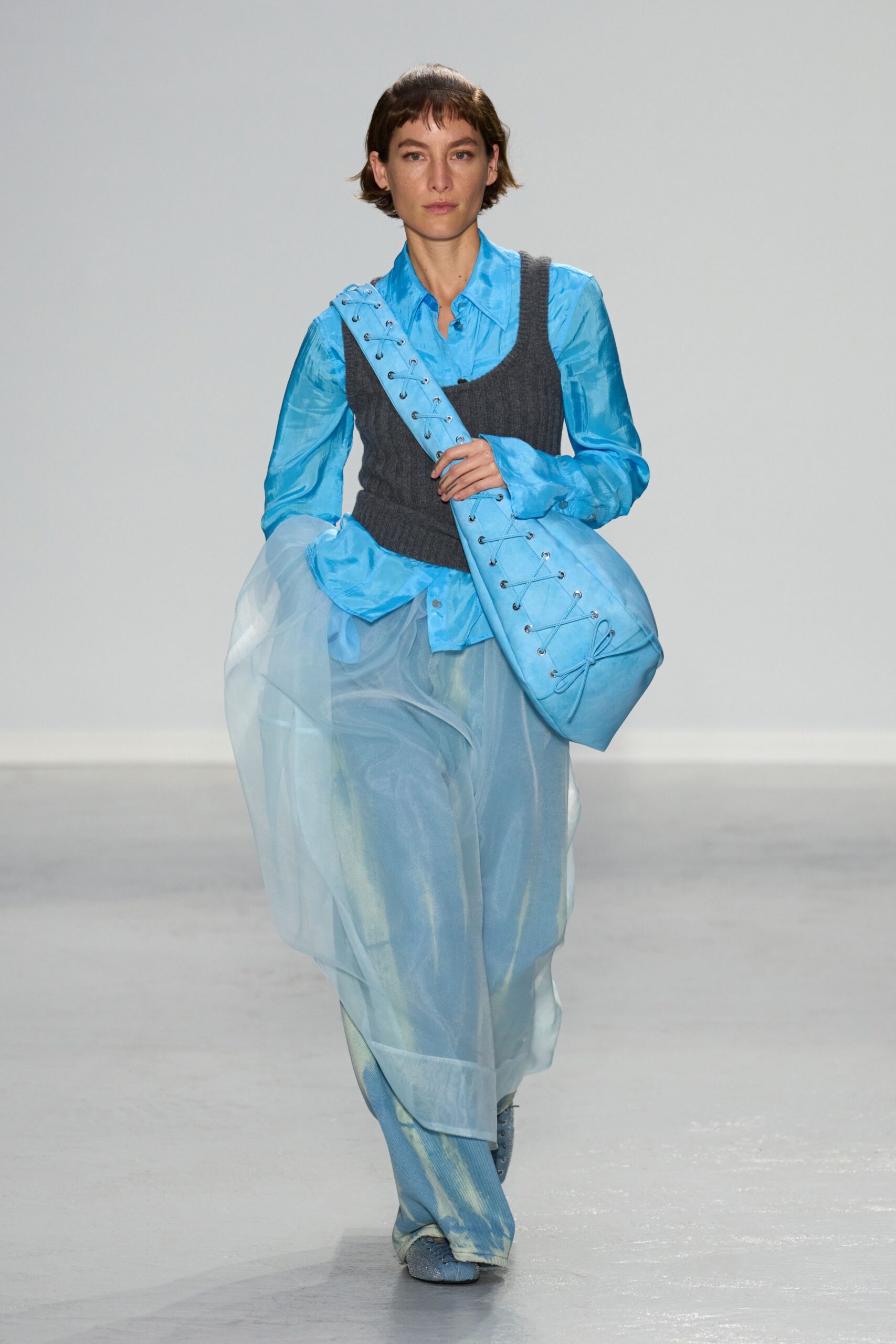 blue shirt gray vest layered skirt