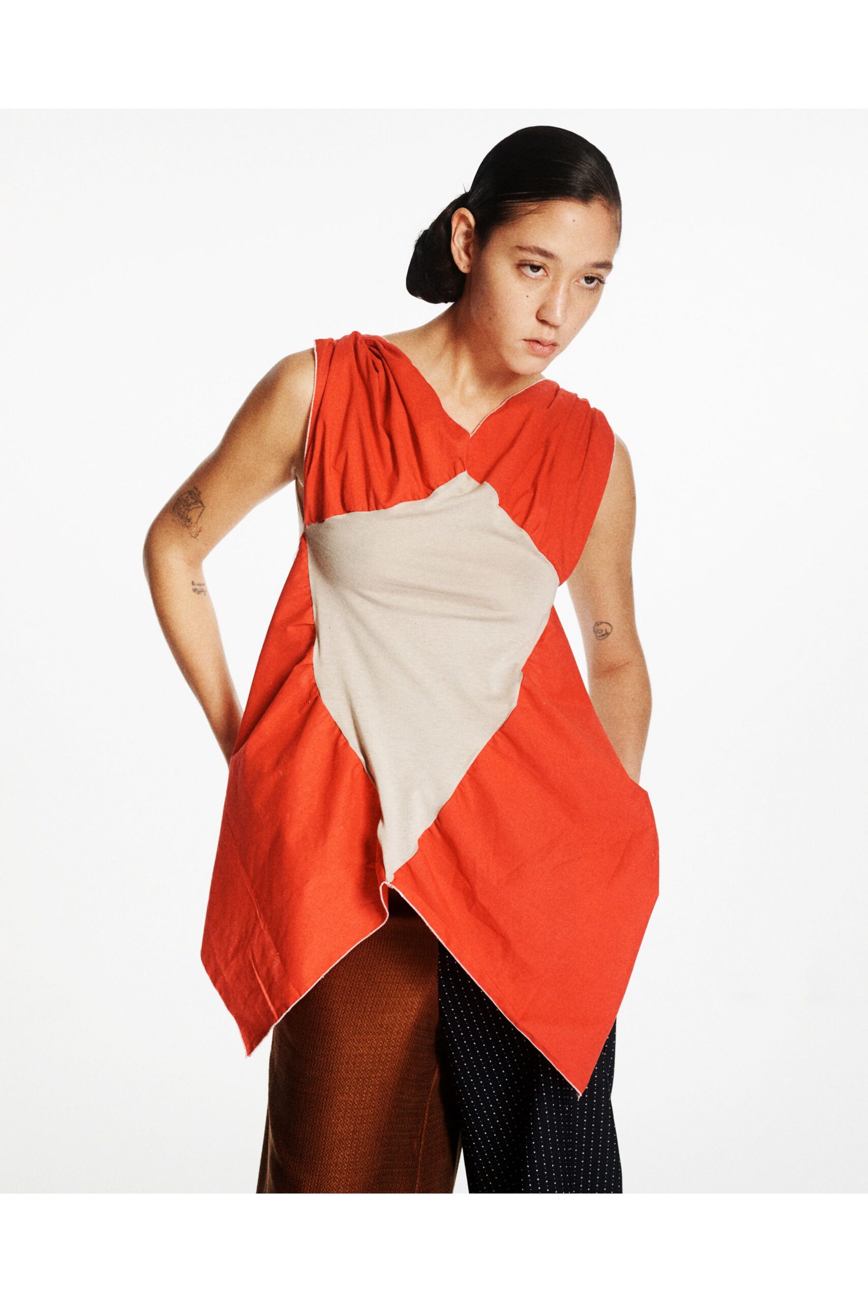 asymmetric red beige top with relaxed pants