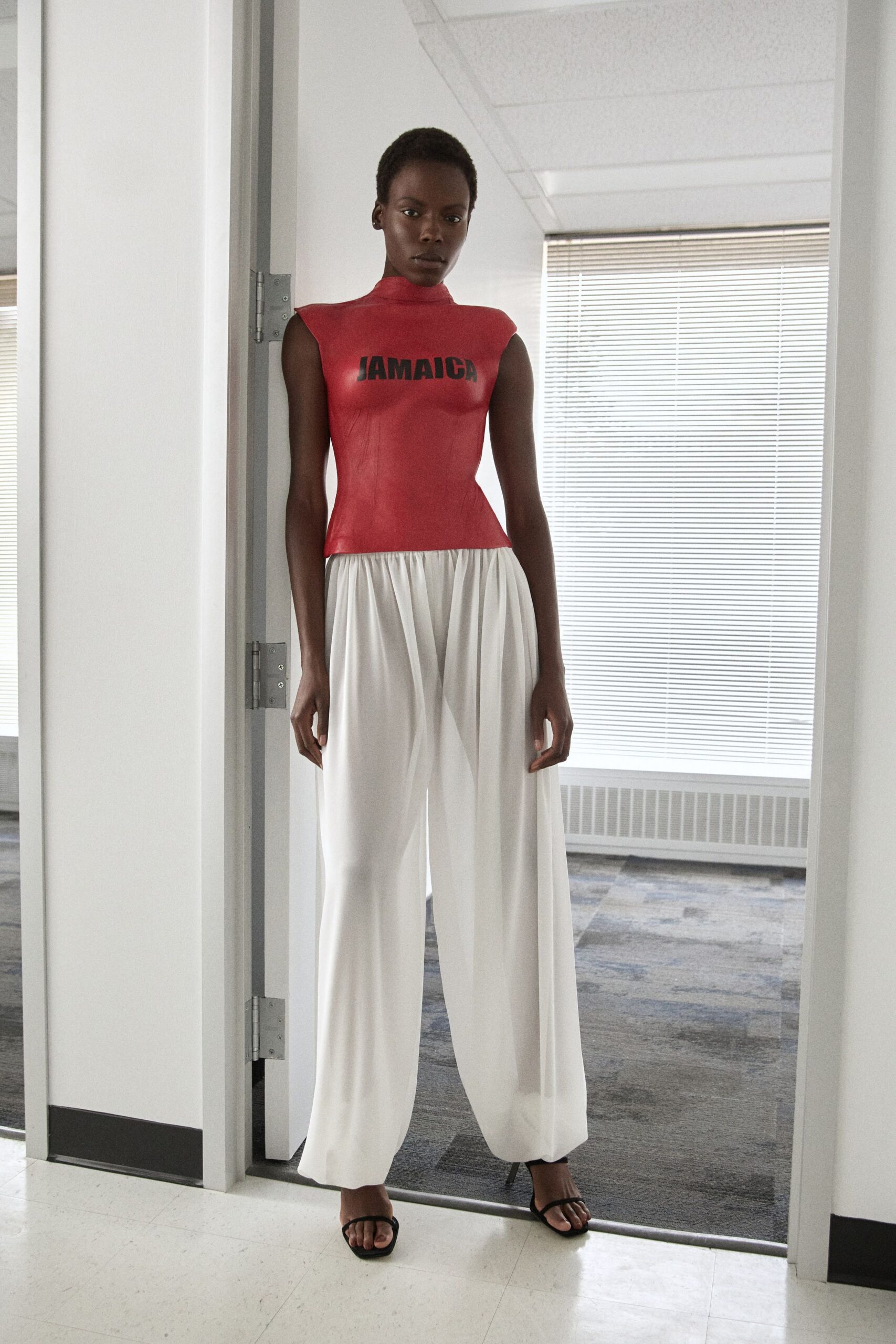 red fitted top white wide-leg pants