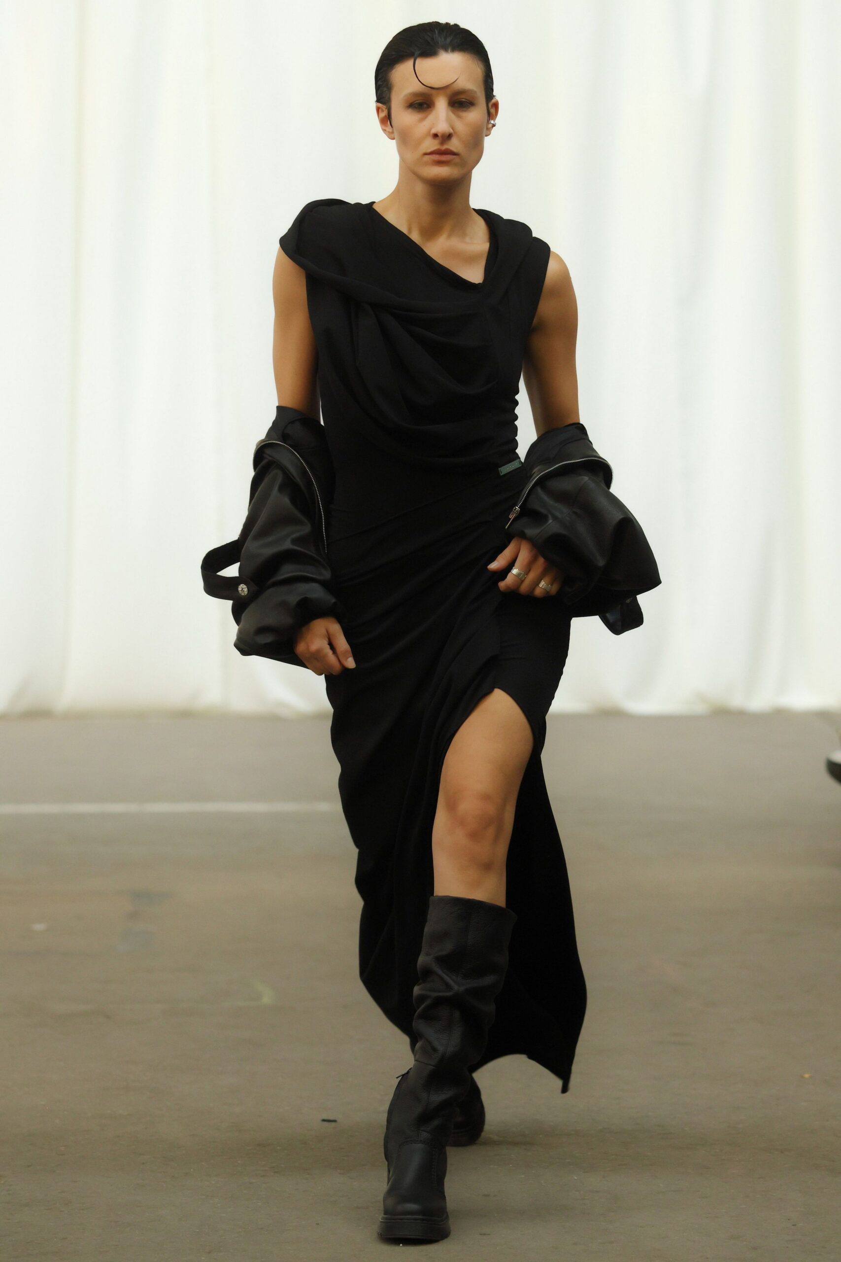 black fitted midi dress with coat and boots