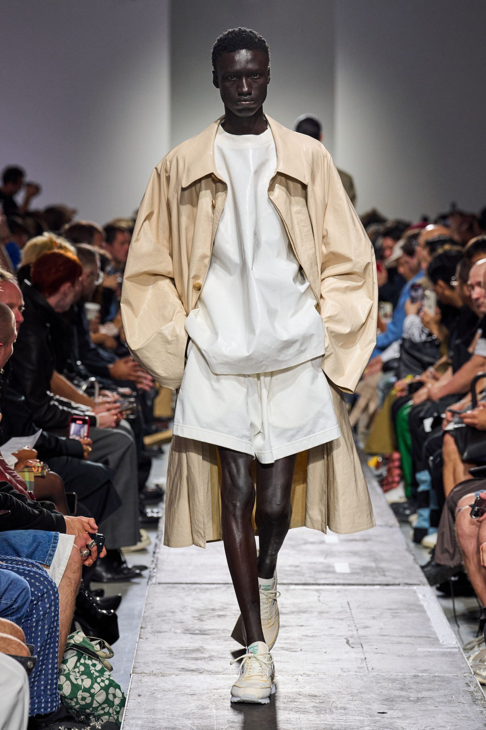 beige vinyl coat with white top and shorts