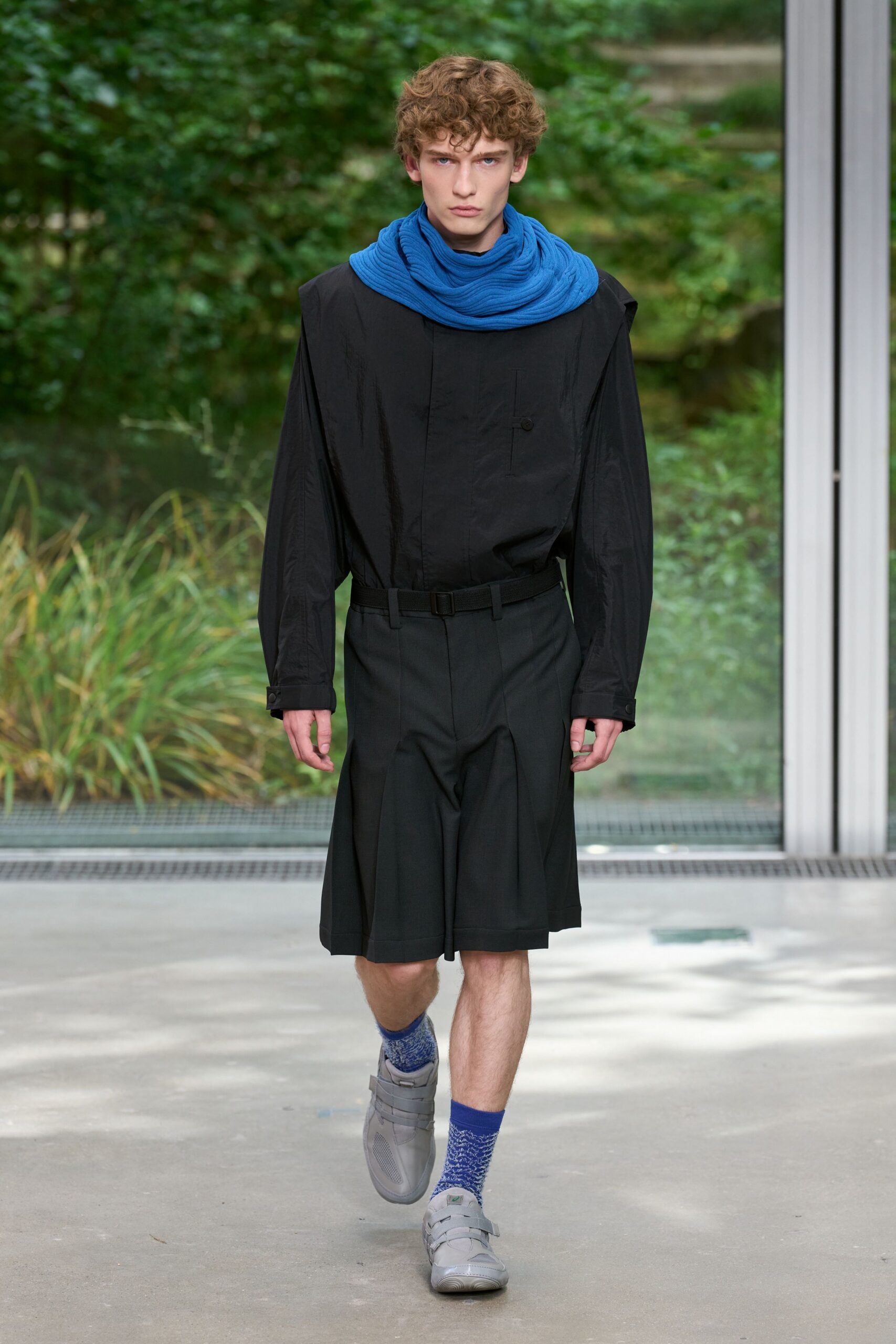 black relaxed shirt with pleated shorts