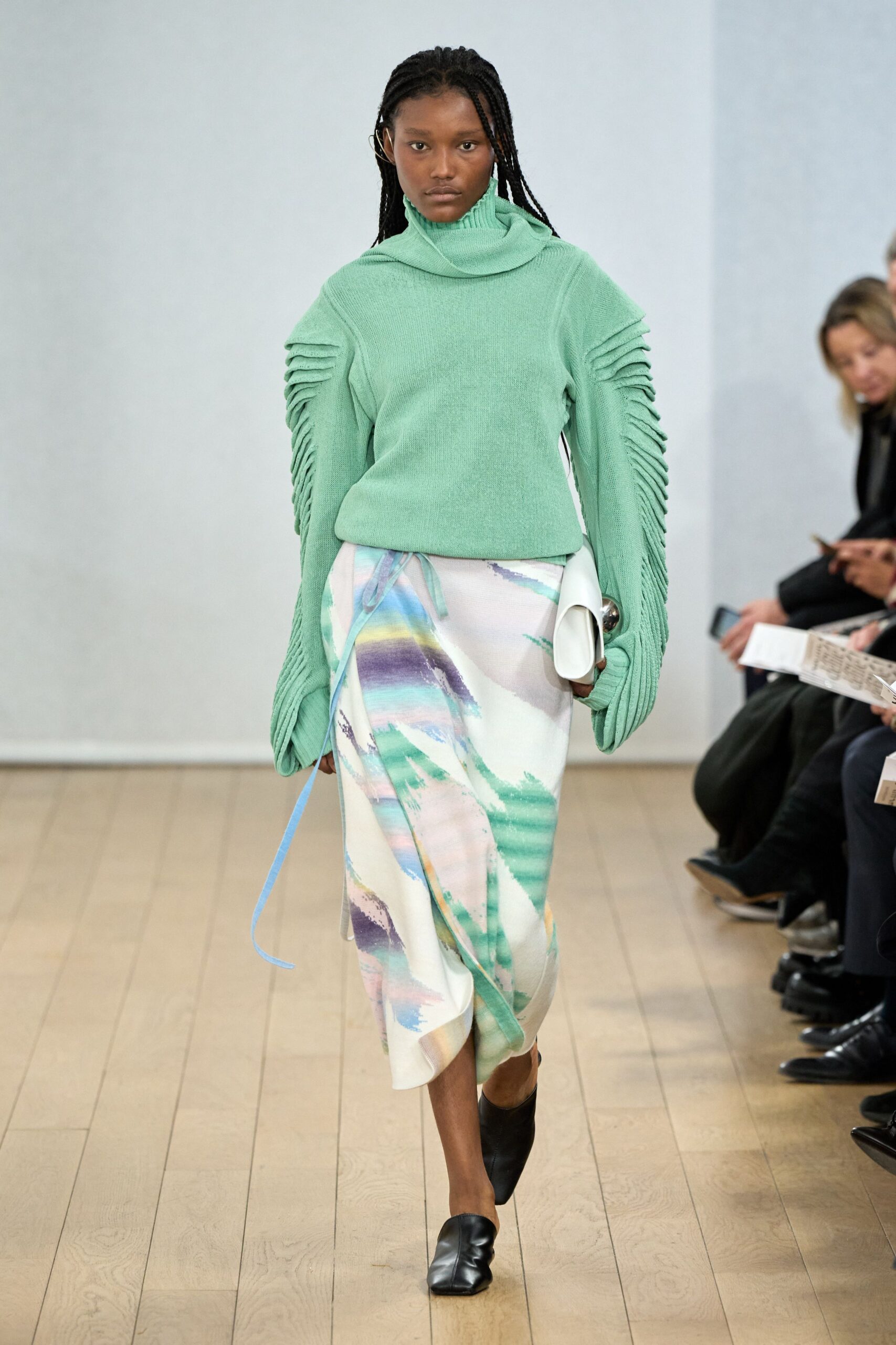 green sweater multi skirt outfit