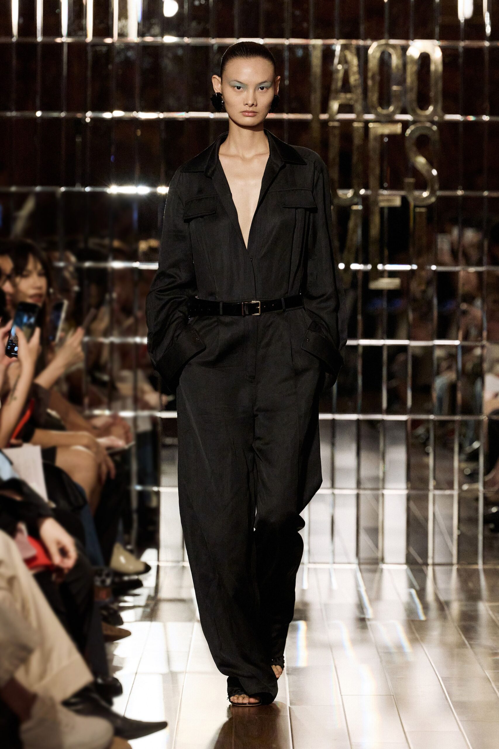 black relaxed jumpsuit with tan shoes