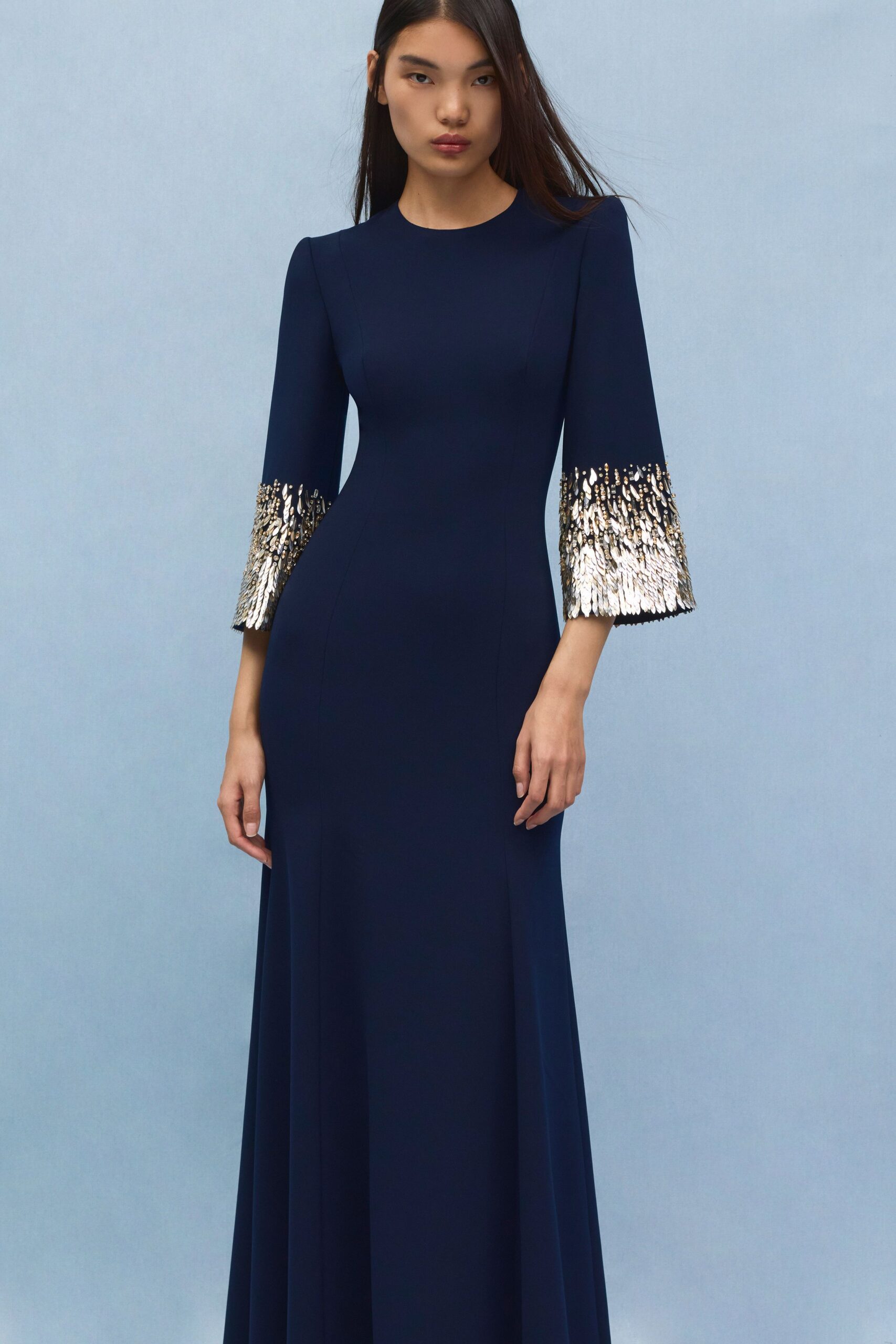 navy gown with gold embellished sleeves