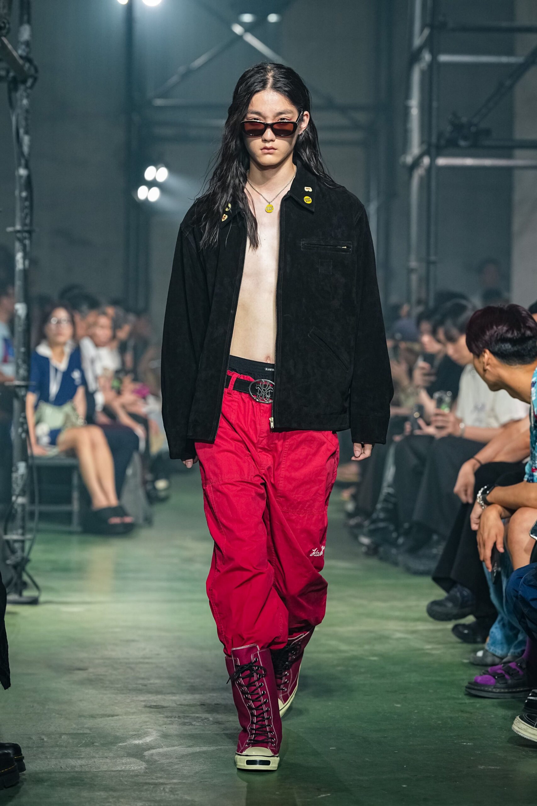 black suede jacket with red cargo pants