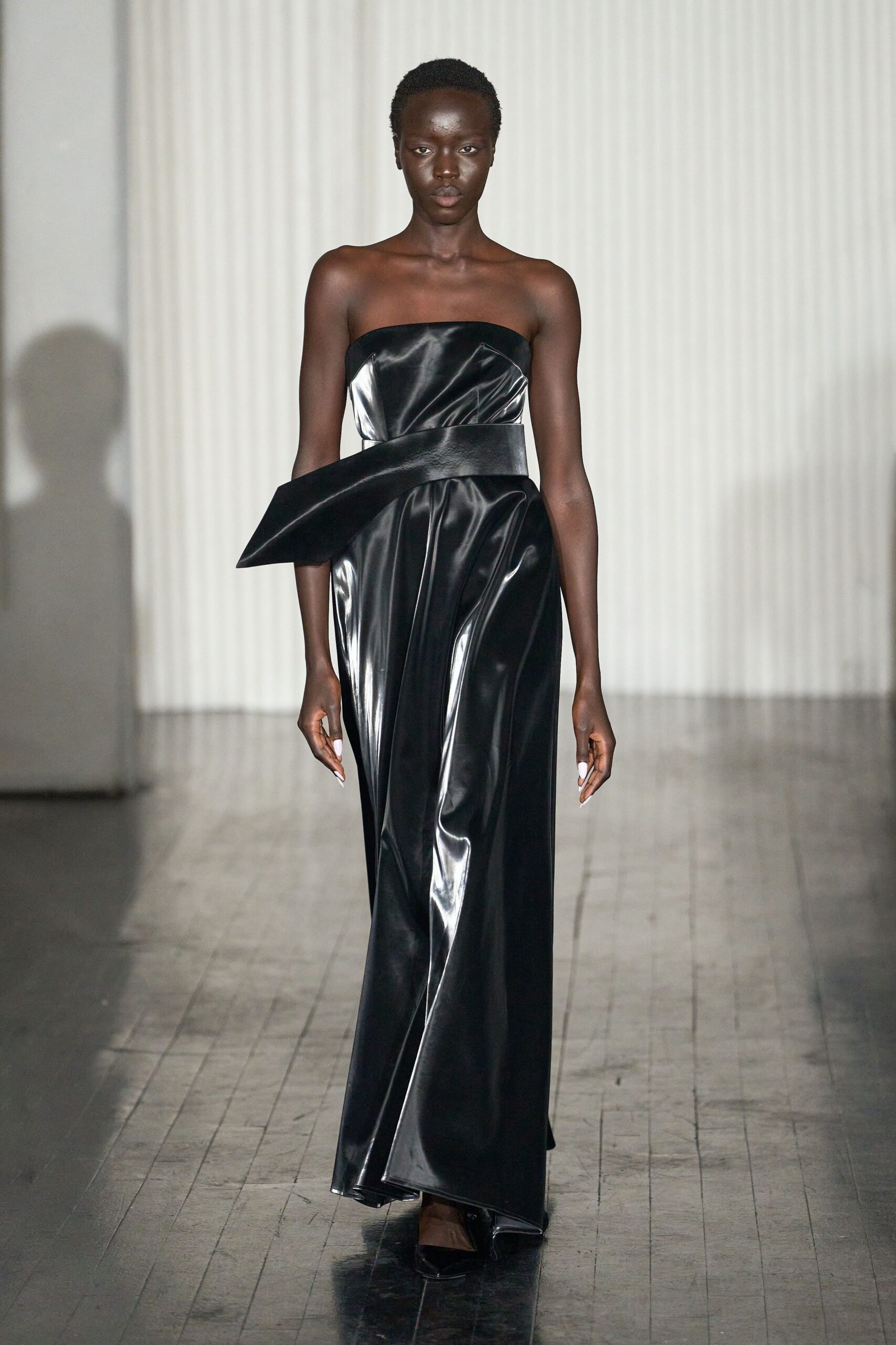 black vinyl strapless gown