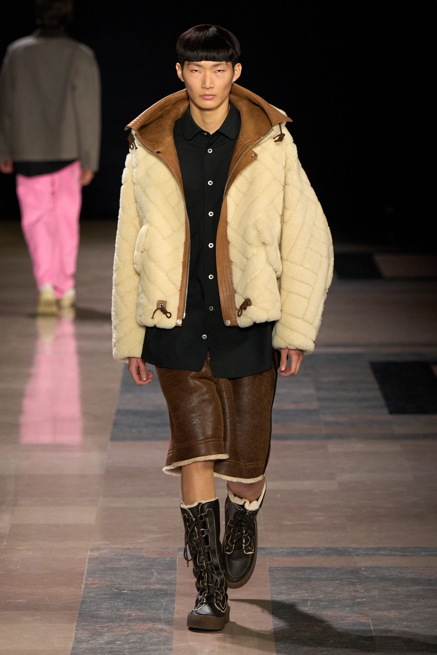 beige faux-fur jacket with black shirt