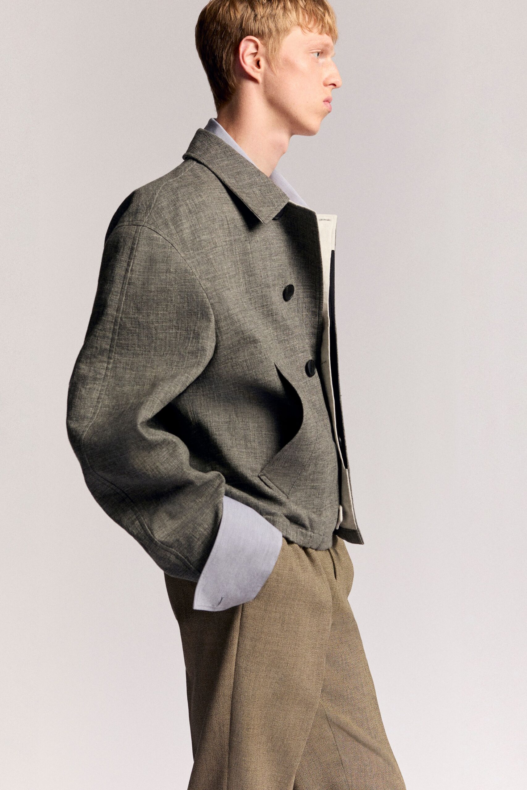 gray relaxed jacket with beige tailored pants
