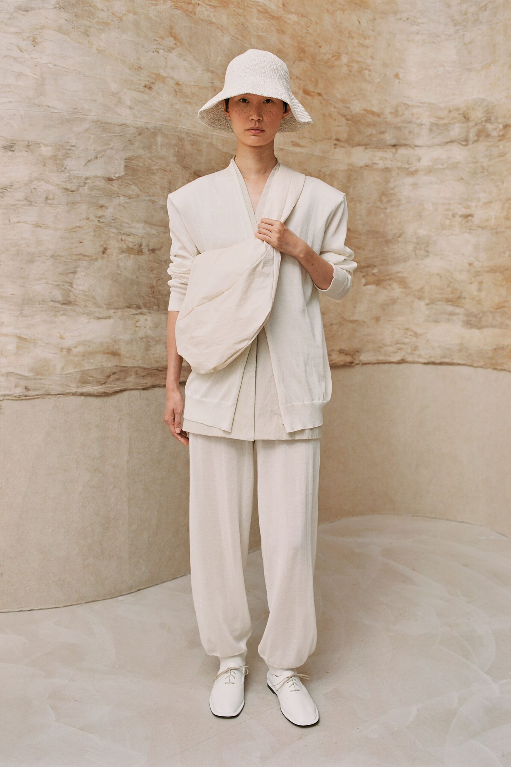 white relaxed outfit with hat