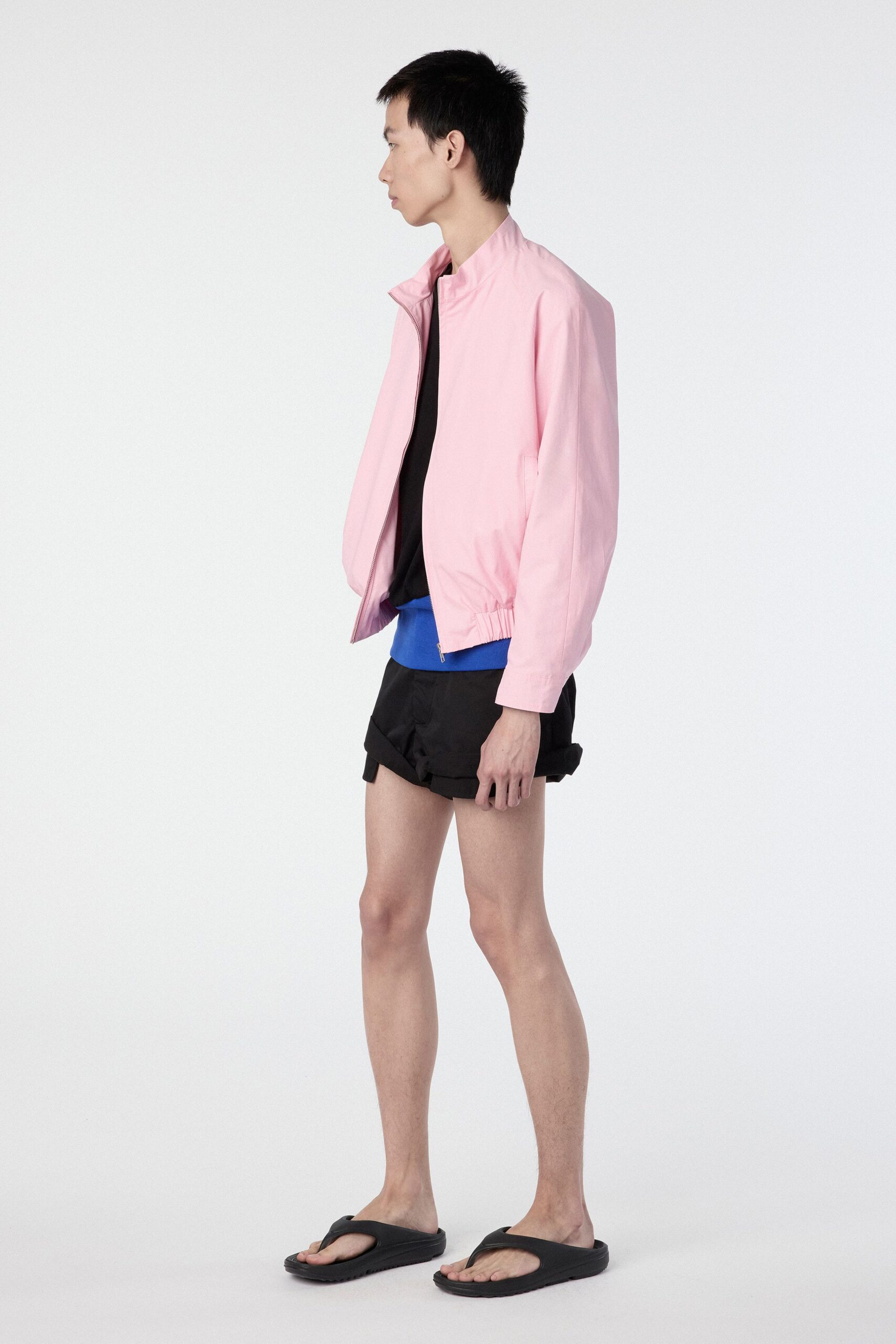 pink jacket black t-shirt shorts sandals