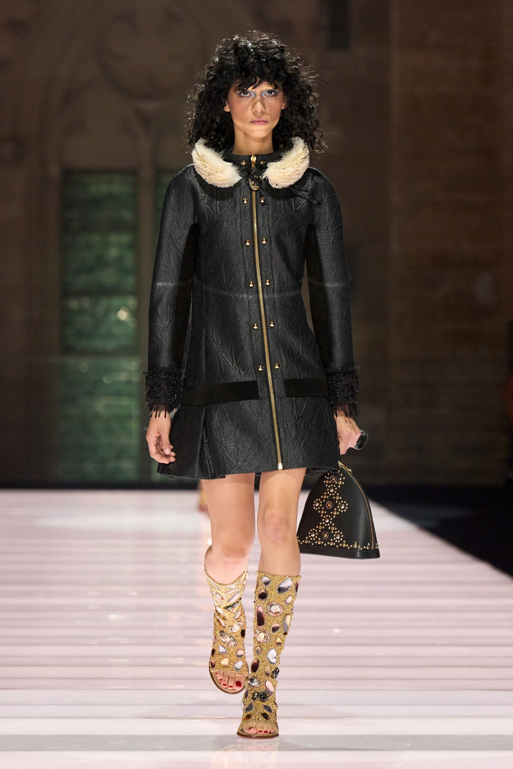 black leather long-sleeve collared fitted zippered buttoned coat