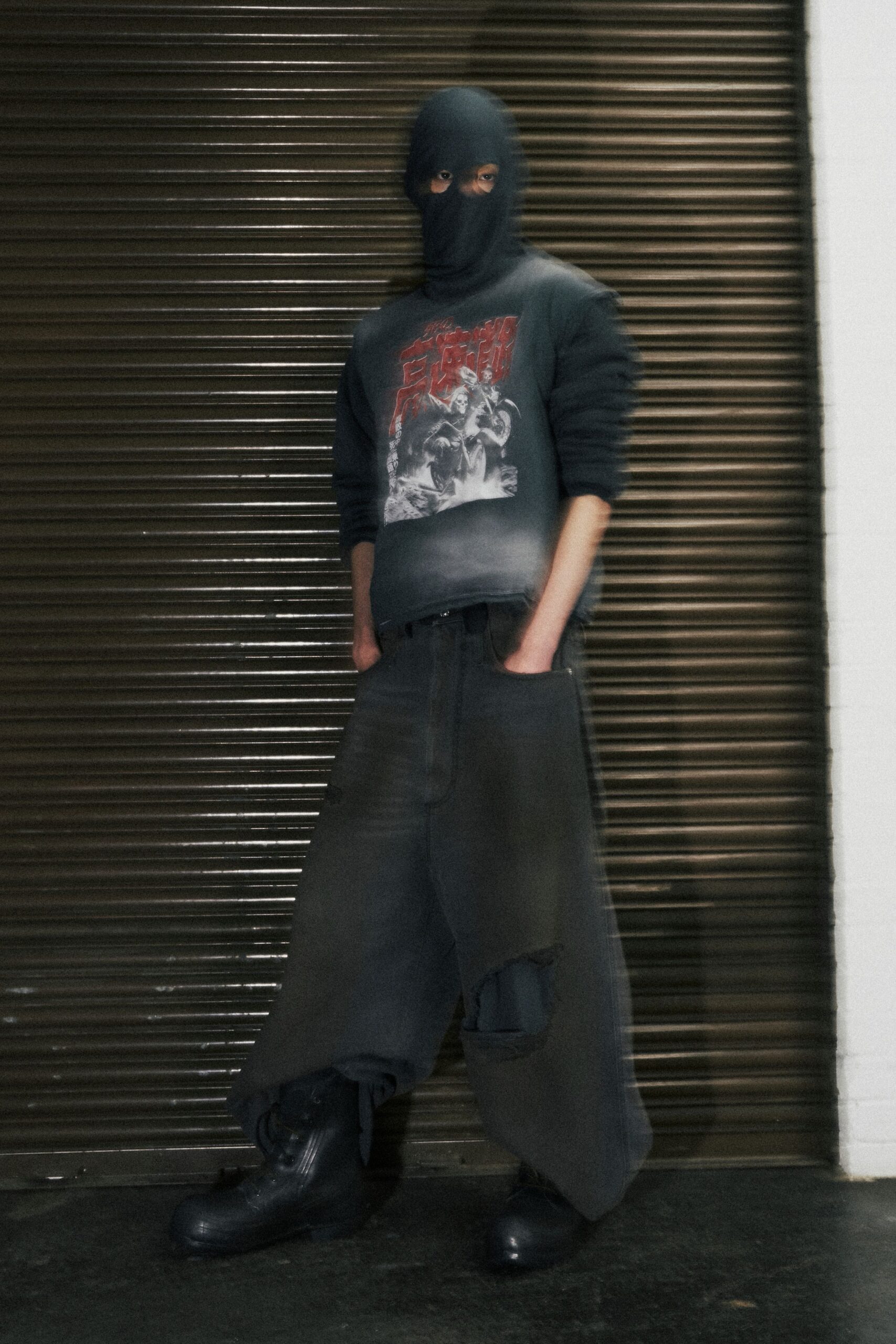 black cotton long-sleeve collared relaxed printed sweater