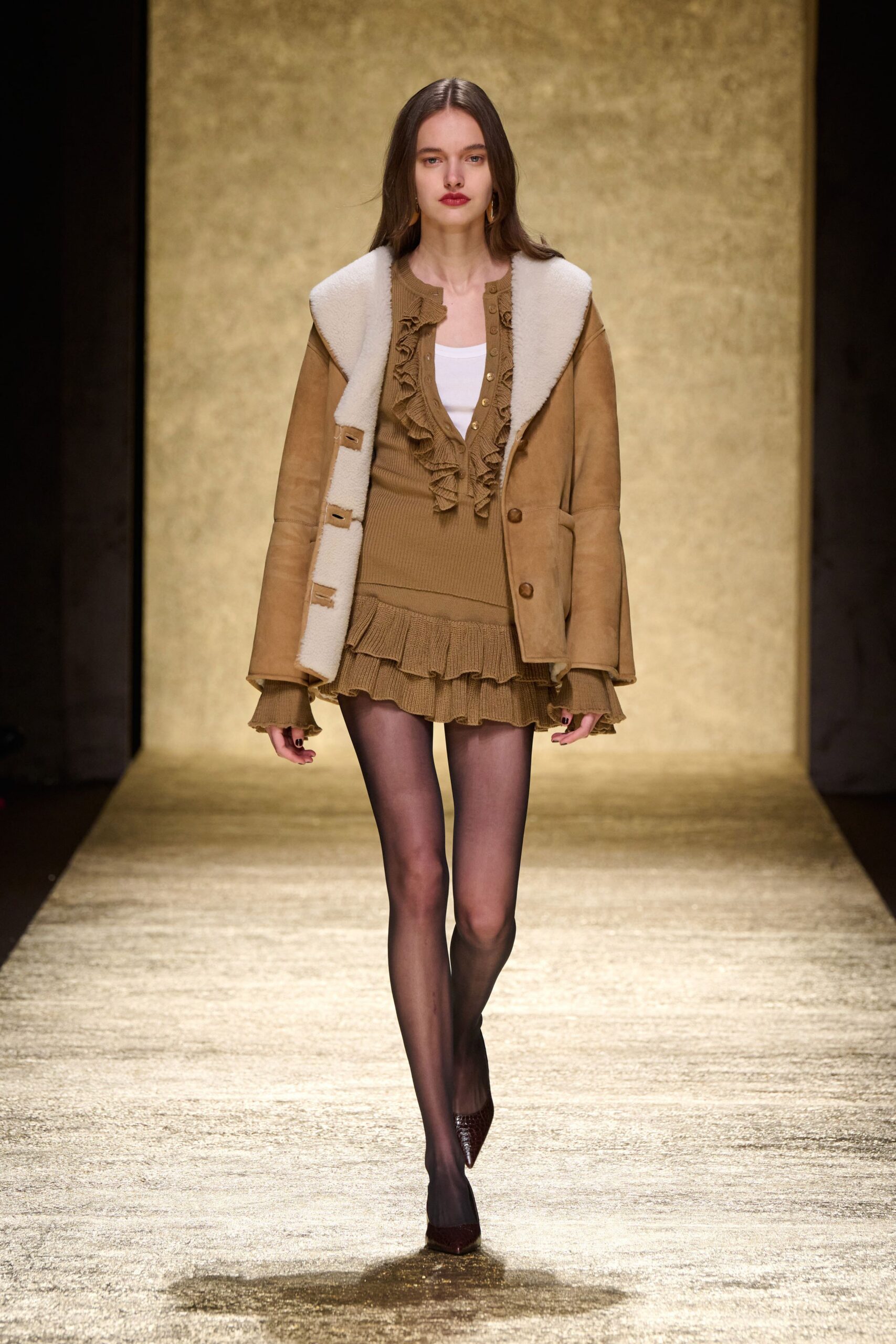 brown suede jacket with beige mini skirt