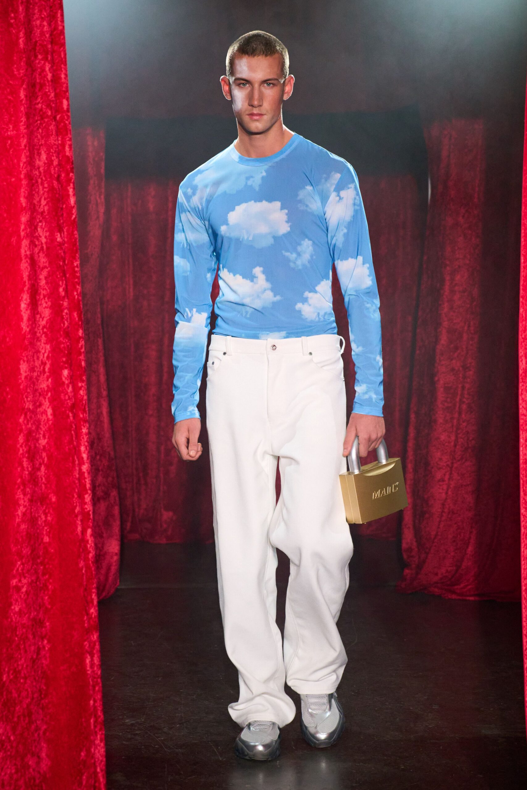 blue cloud print shirt with white pants