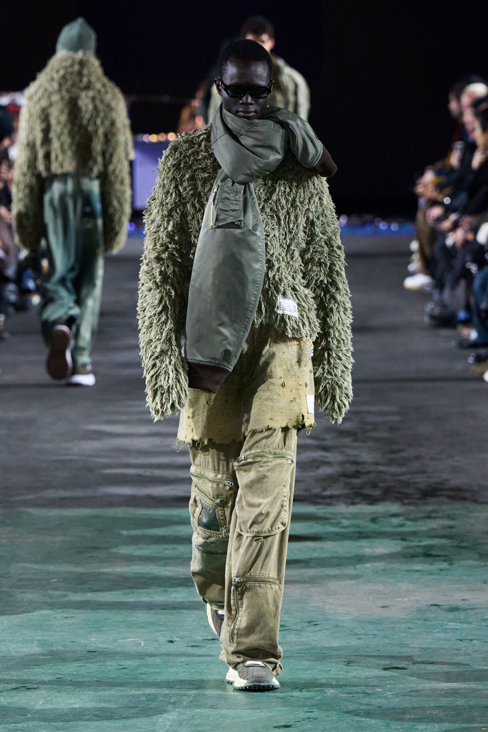 green fringed sweater with cargo pants