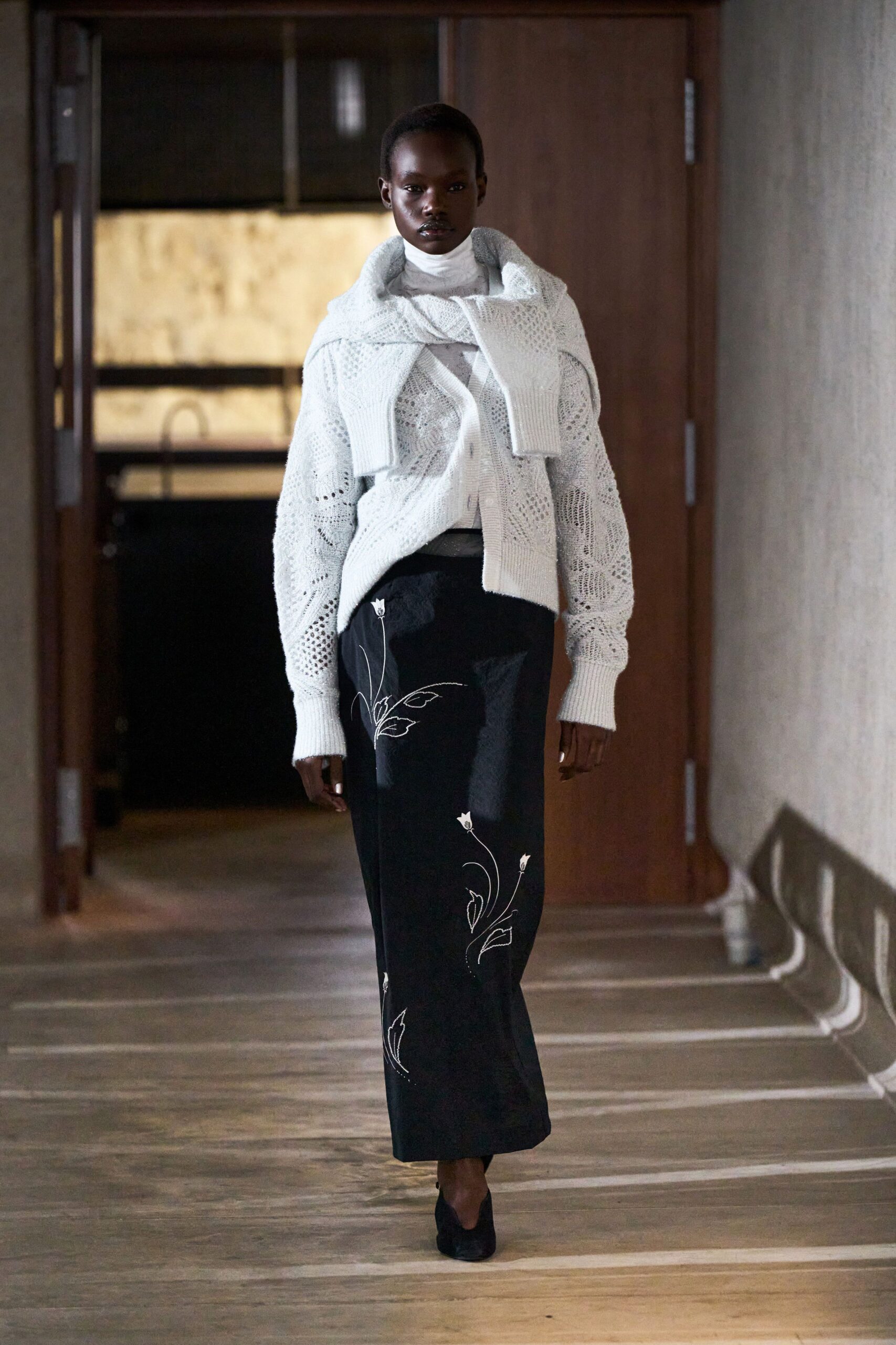 white knit sweater black embroidered skirt