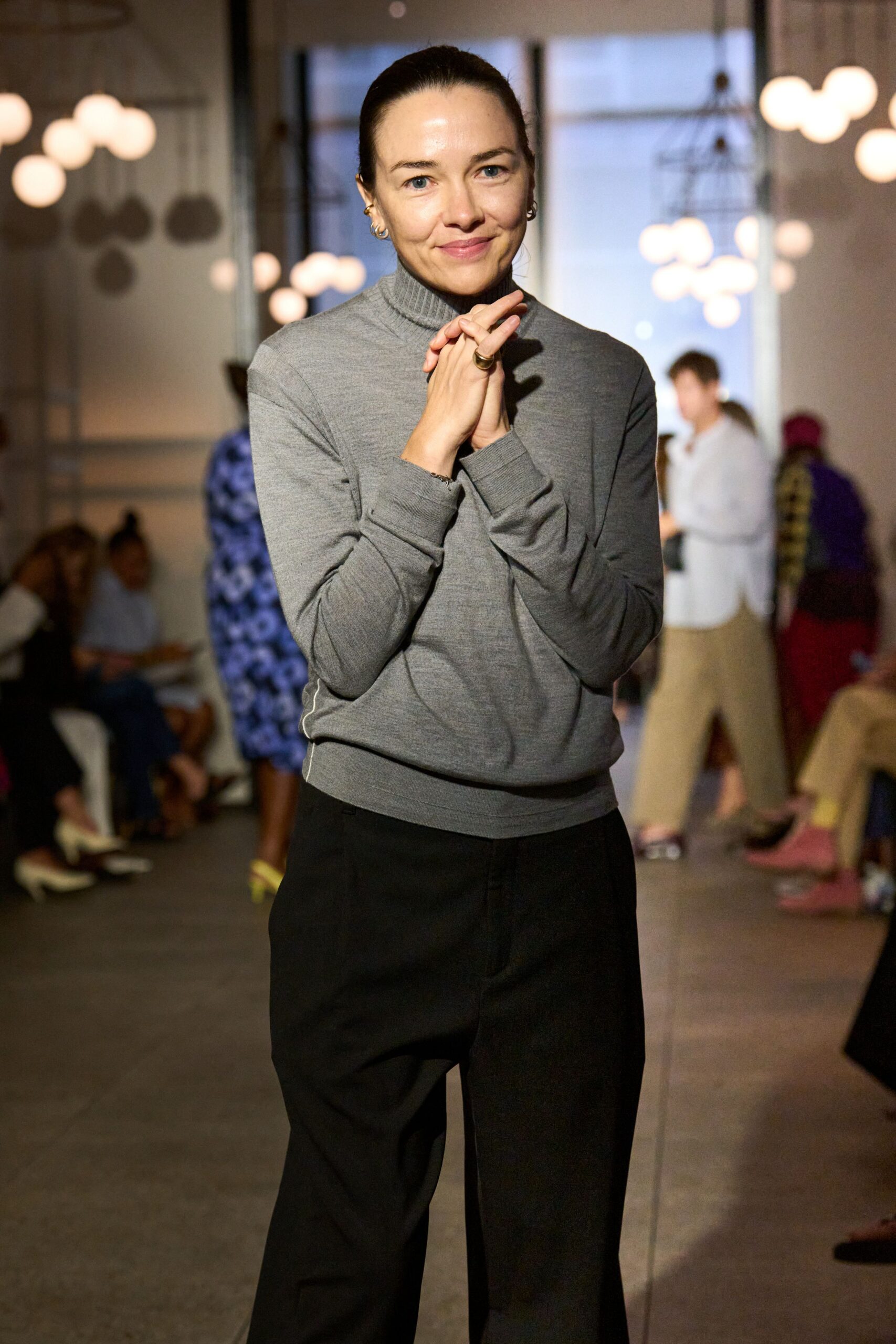 gray fitted turtleneck top and black wide-leg pants