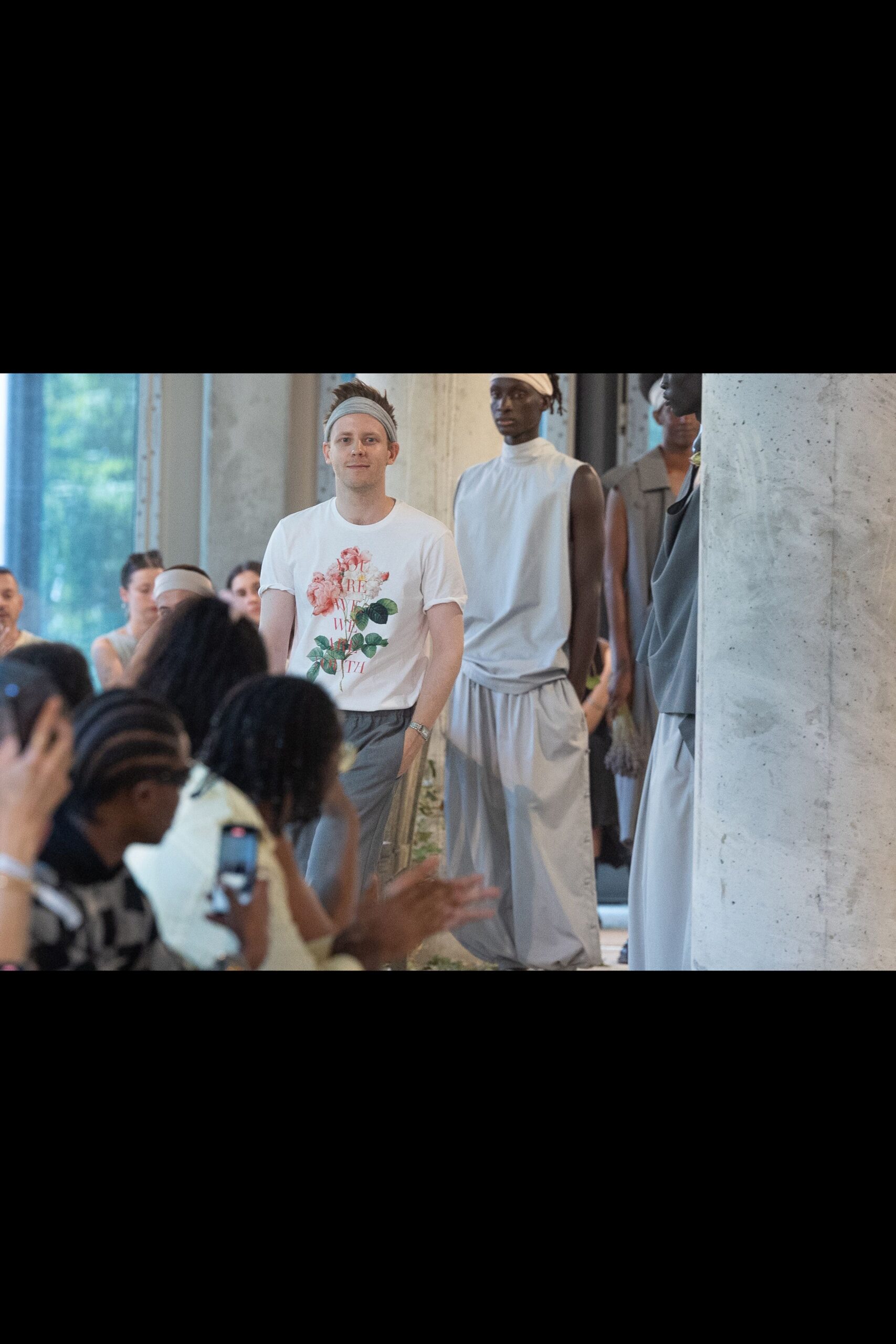 white printed t-shirt and gray pants