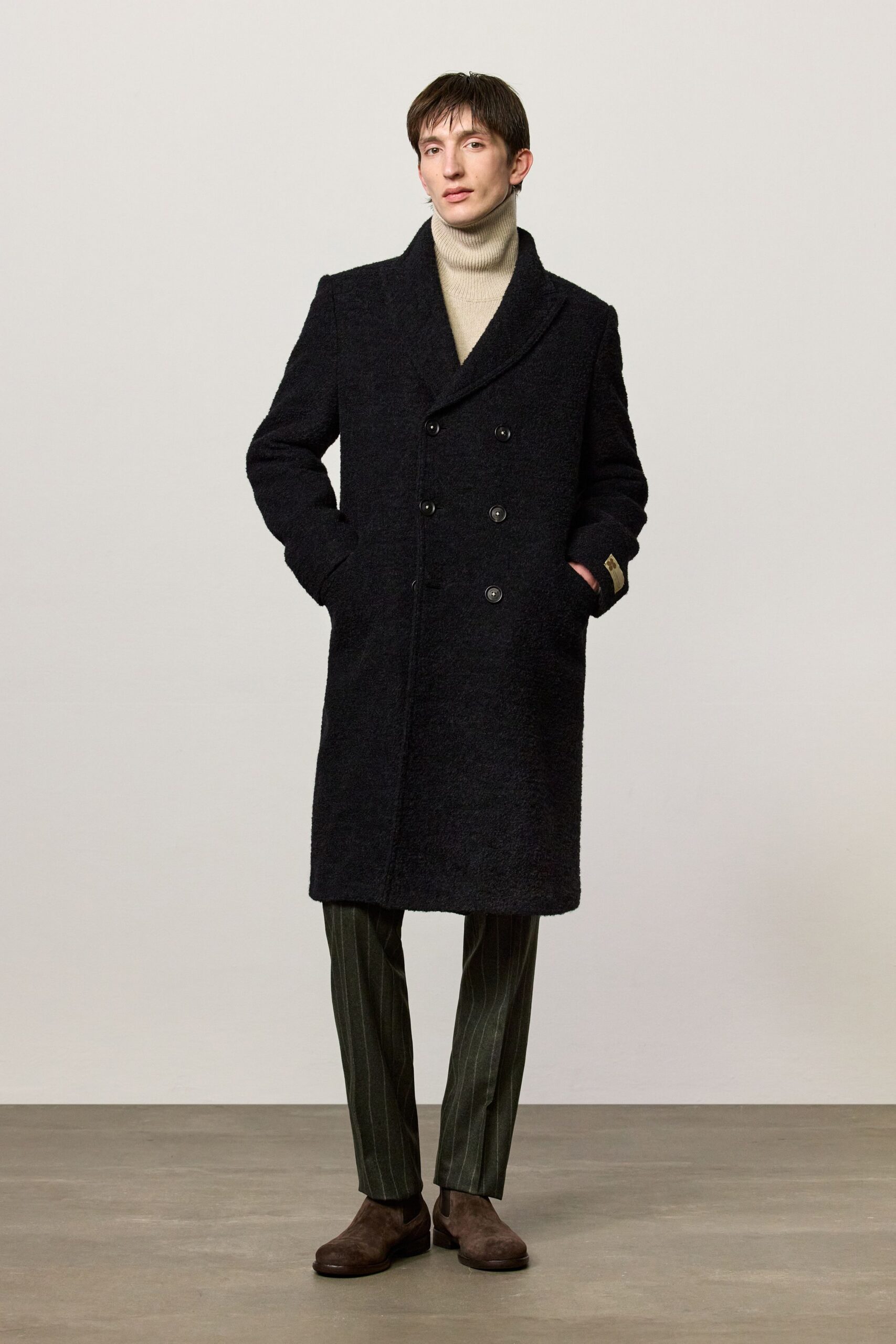 black wool coat beige turtleneck