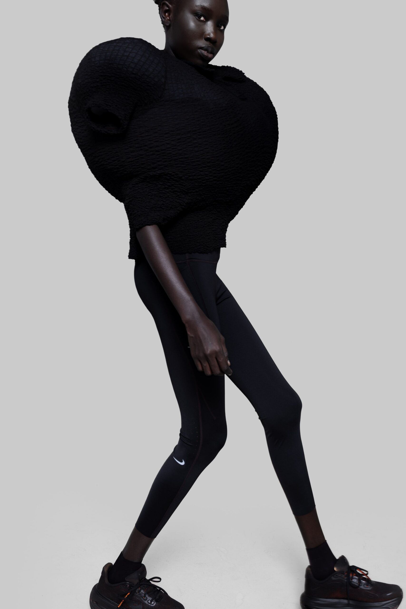 black fitted top with padded details