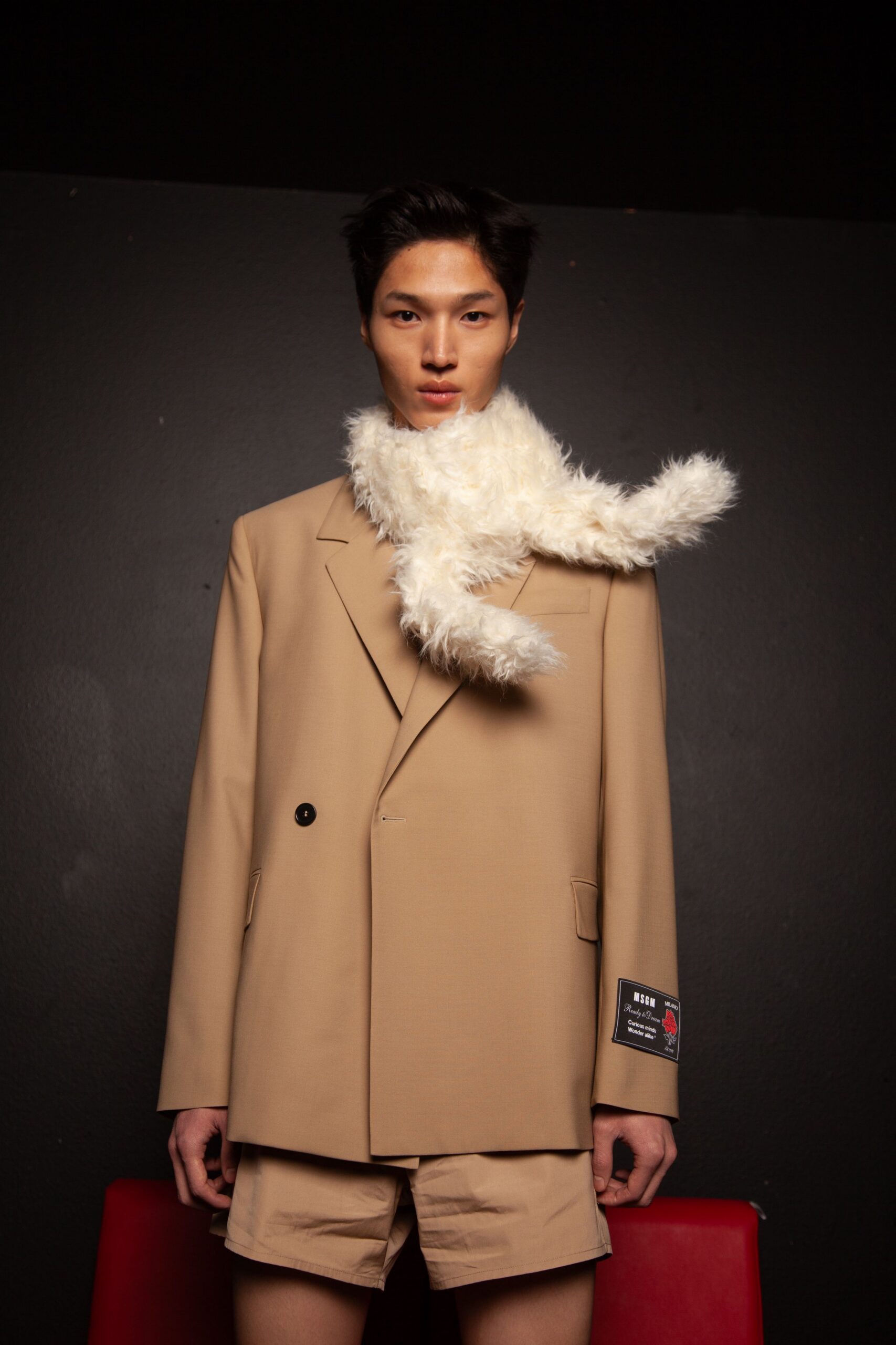 beige blazer with white faux-fur scarf