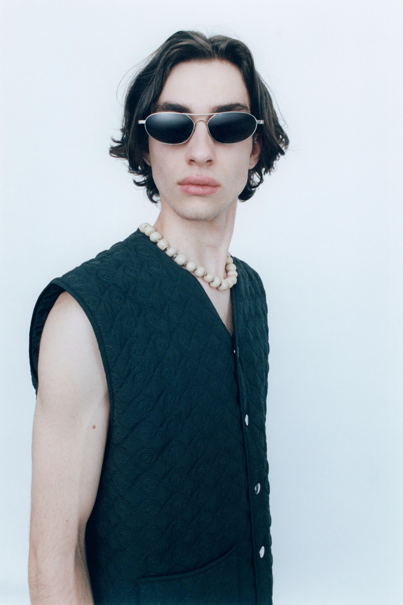 black fitted vest with sunglasses