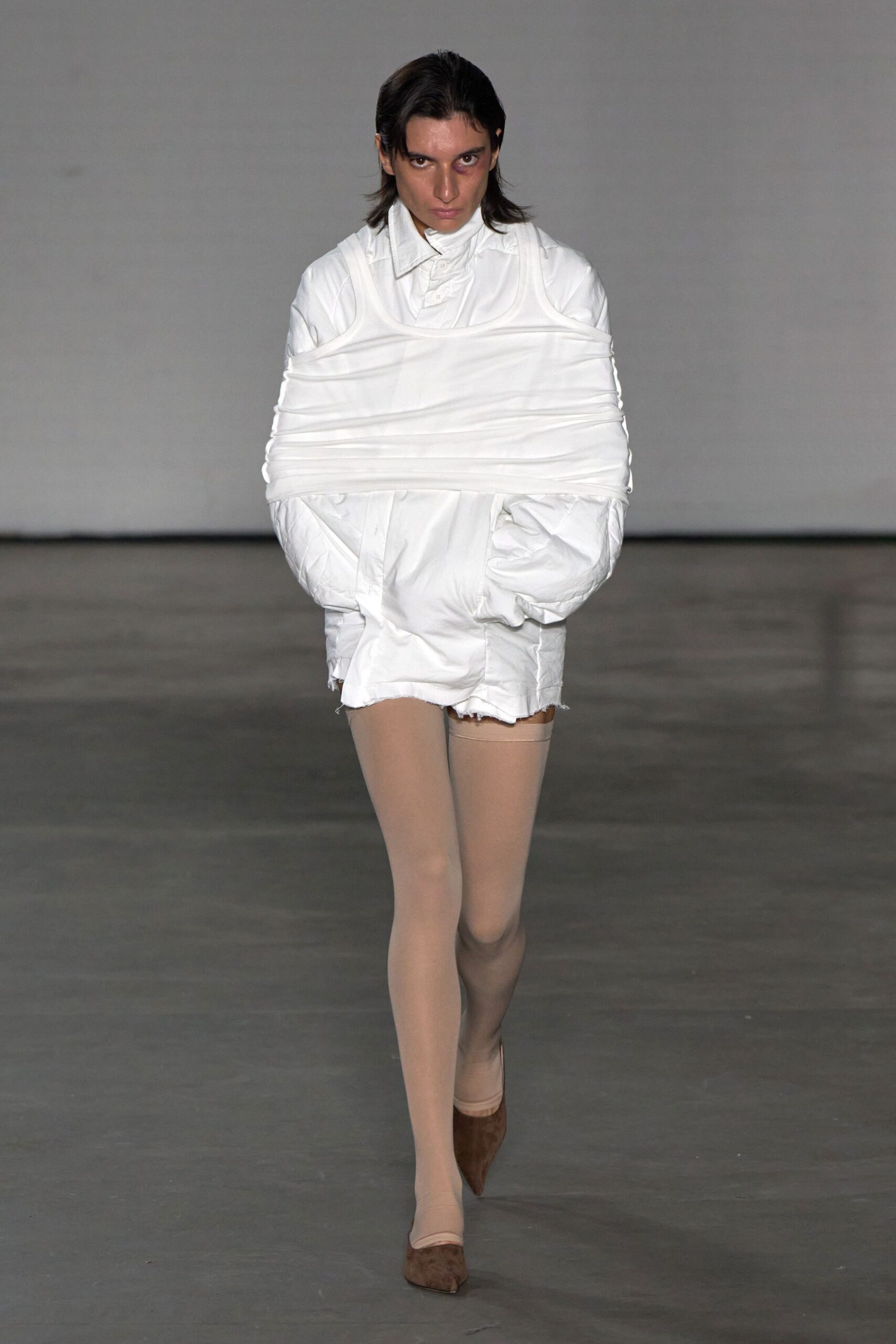 white fitted jacket with distressed shorts