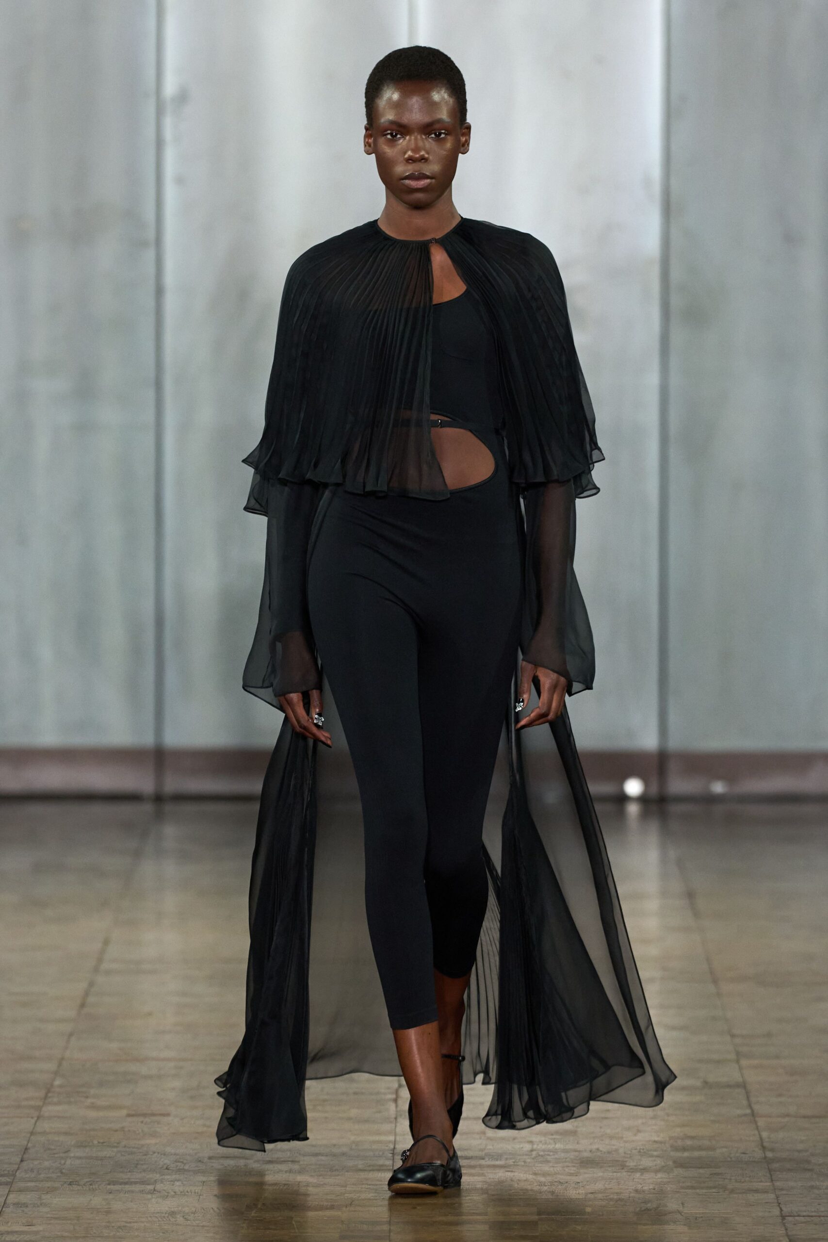 black silk sleeveless cutout fitted pleated flowing top