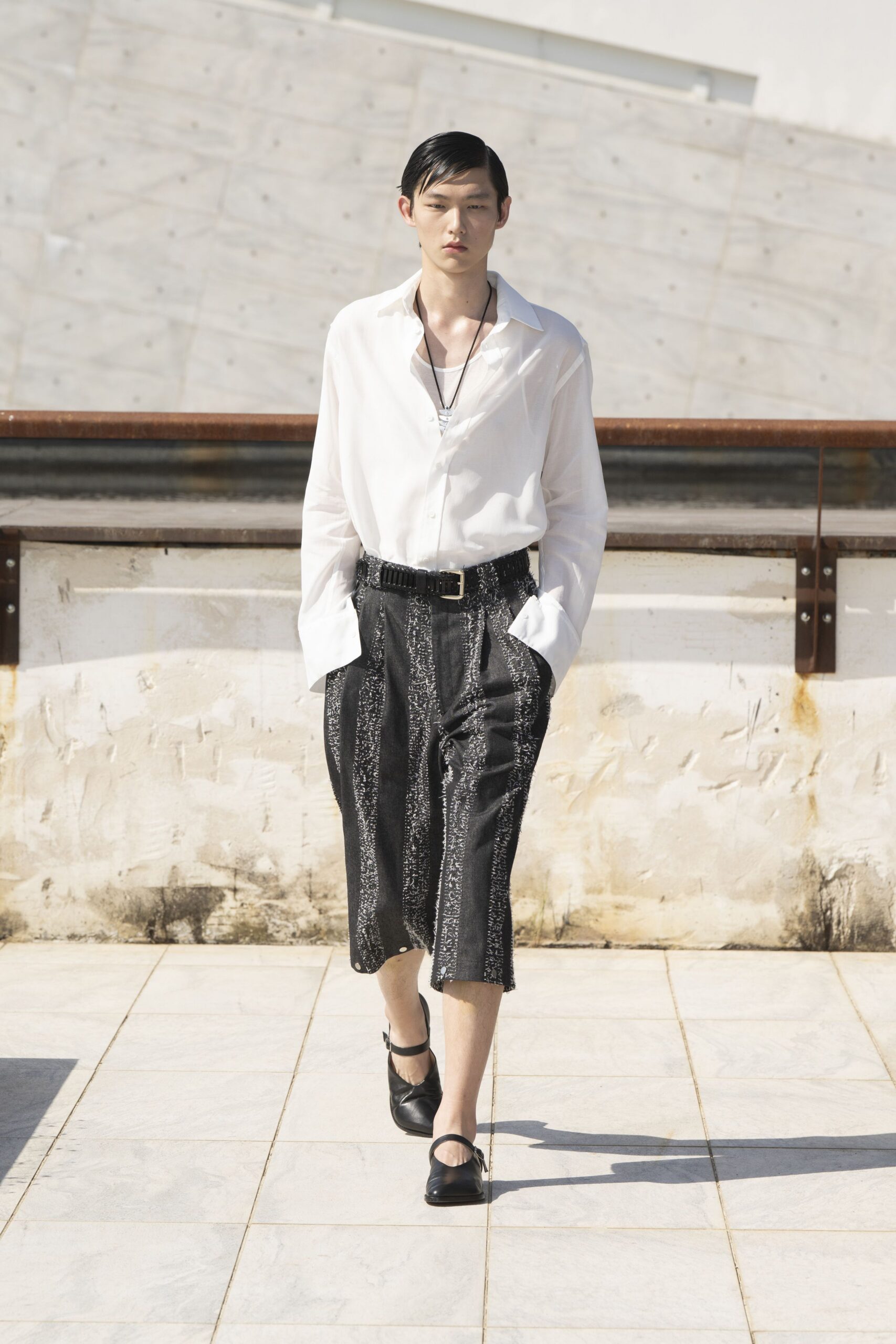 white shirt black pleated pants