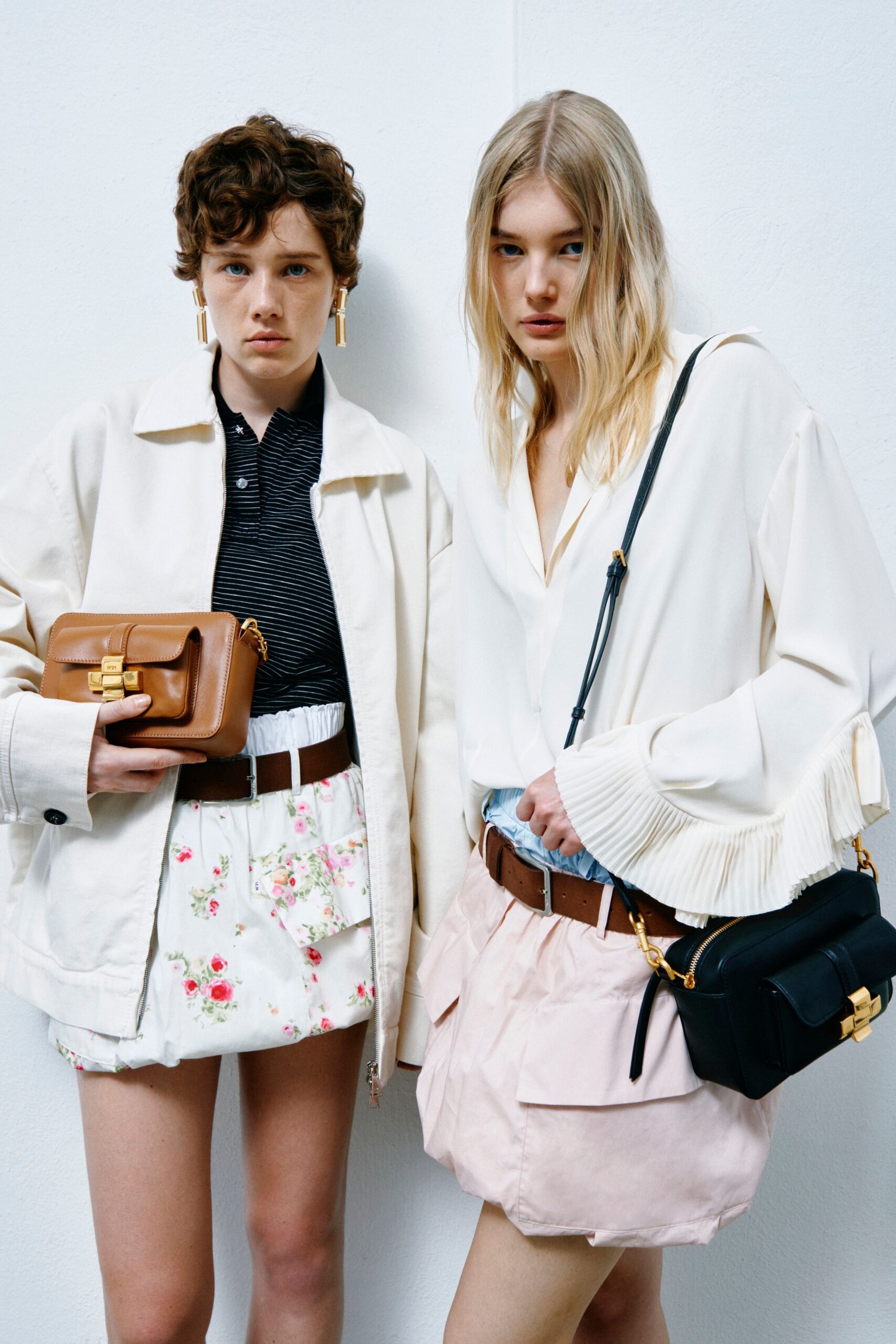 white jacket and floral shorts