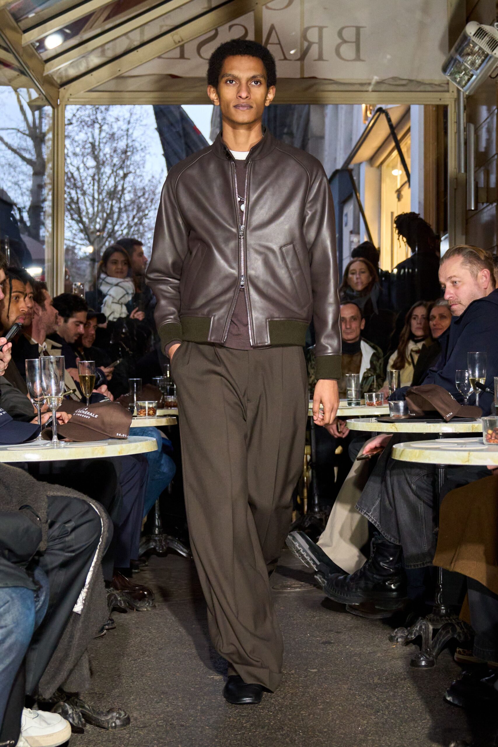 brown leather jacket with green pants