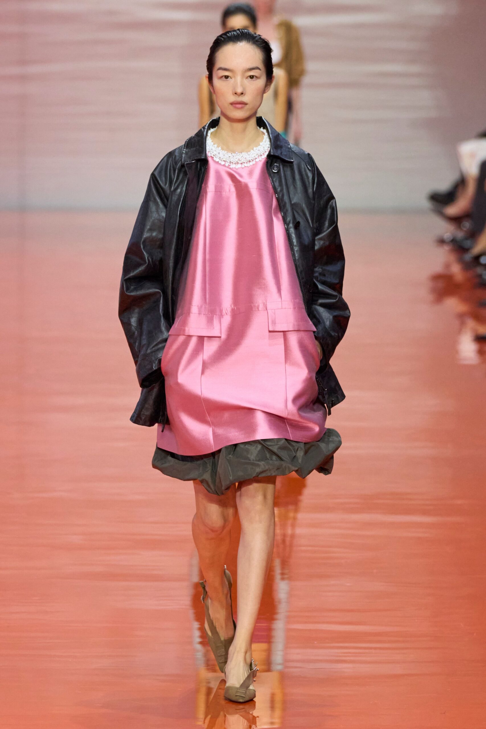 pink silk layered dress with black leather jacket