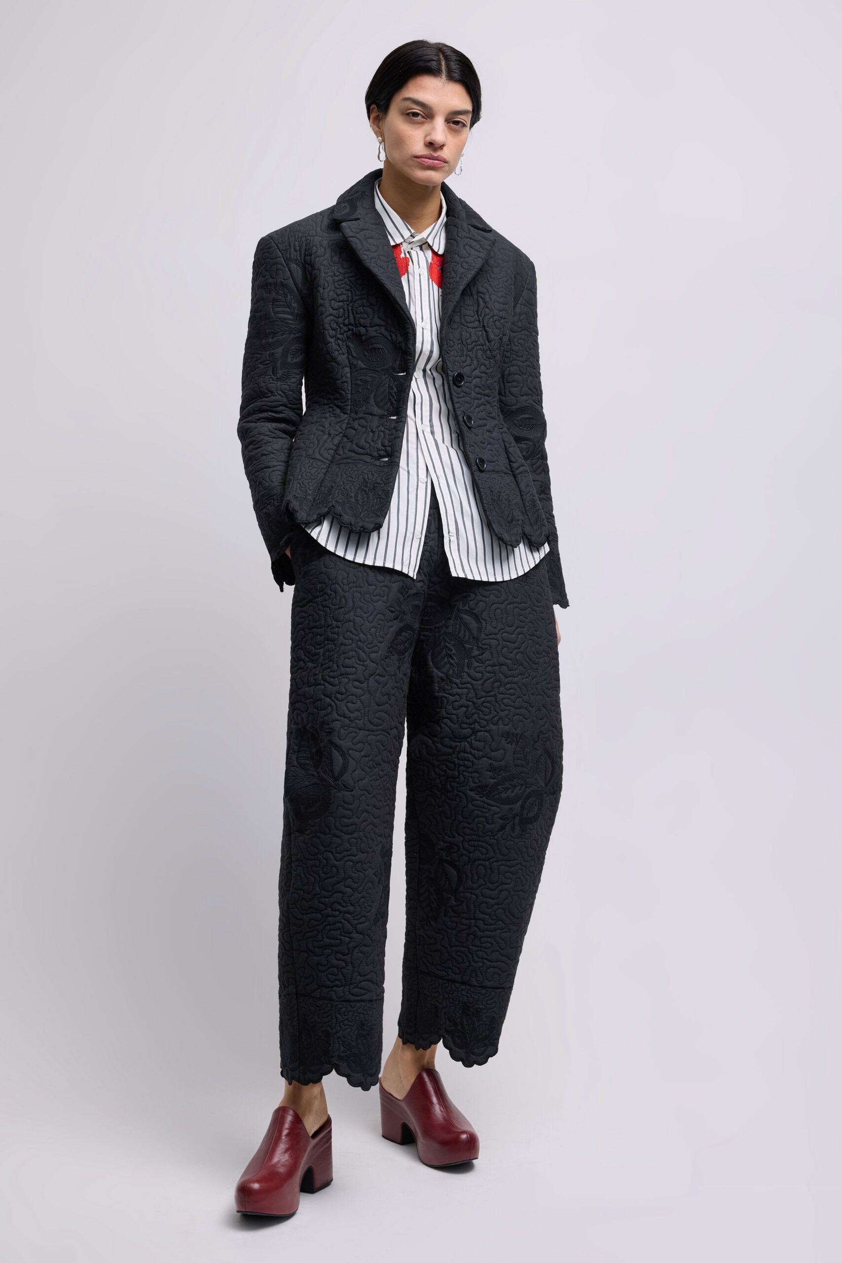 black cotton long-sleeve collared structured textured blazer