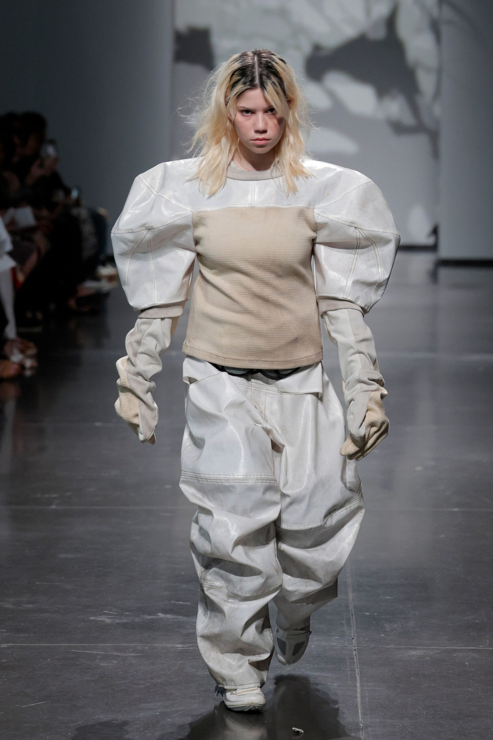 beige relaxed top with white cargo pants
