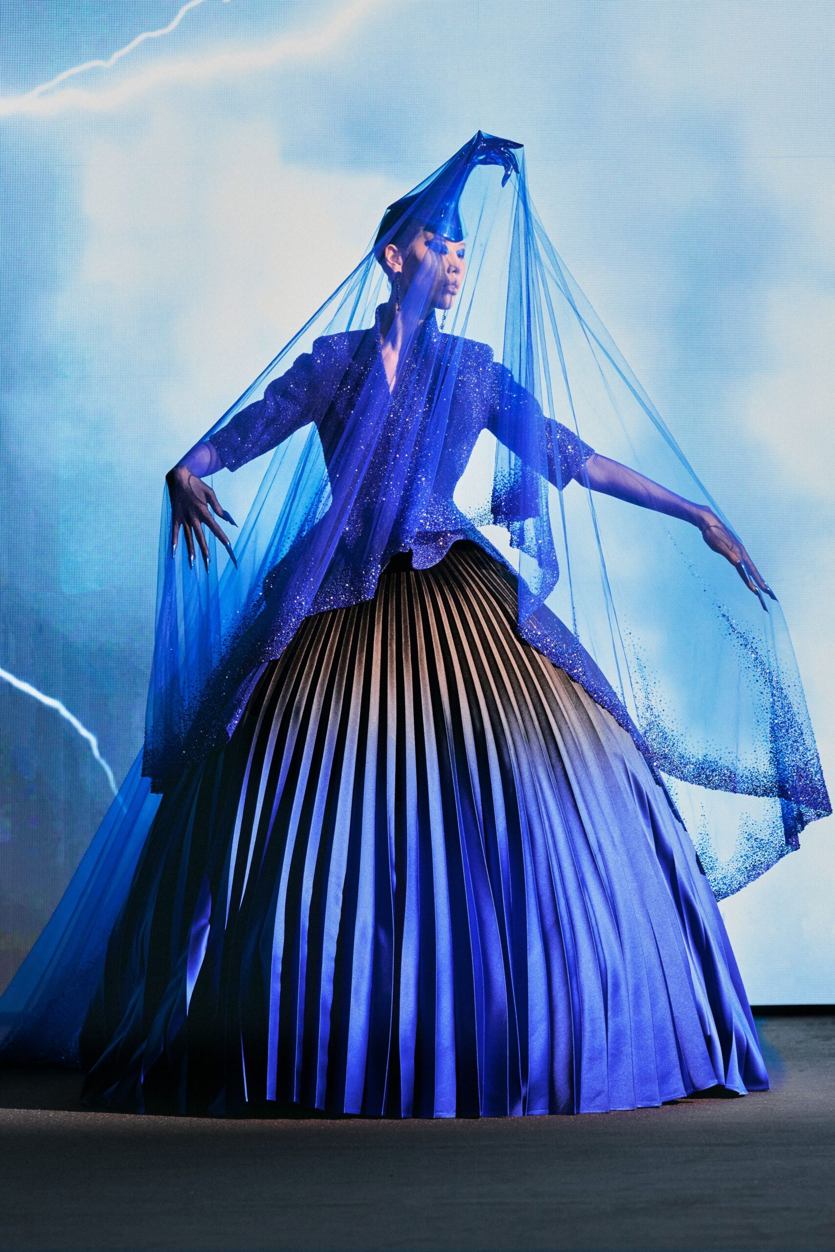 blue silk pleated gown with veil
