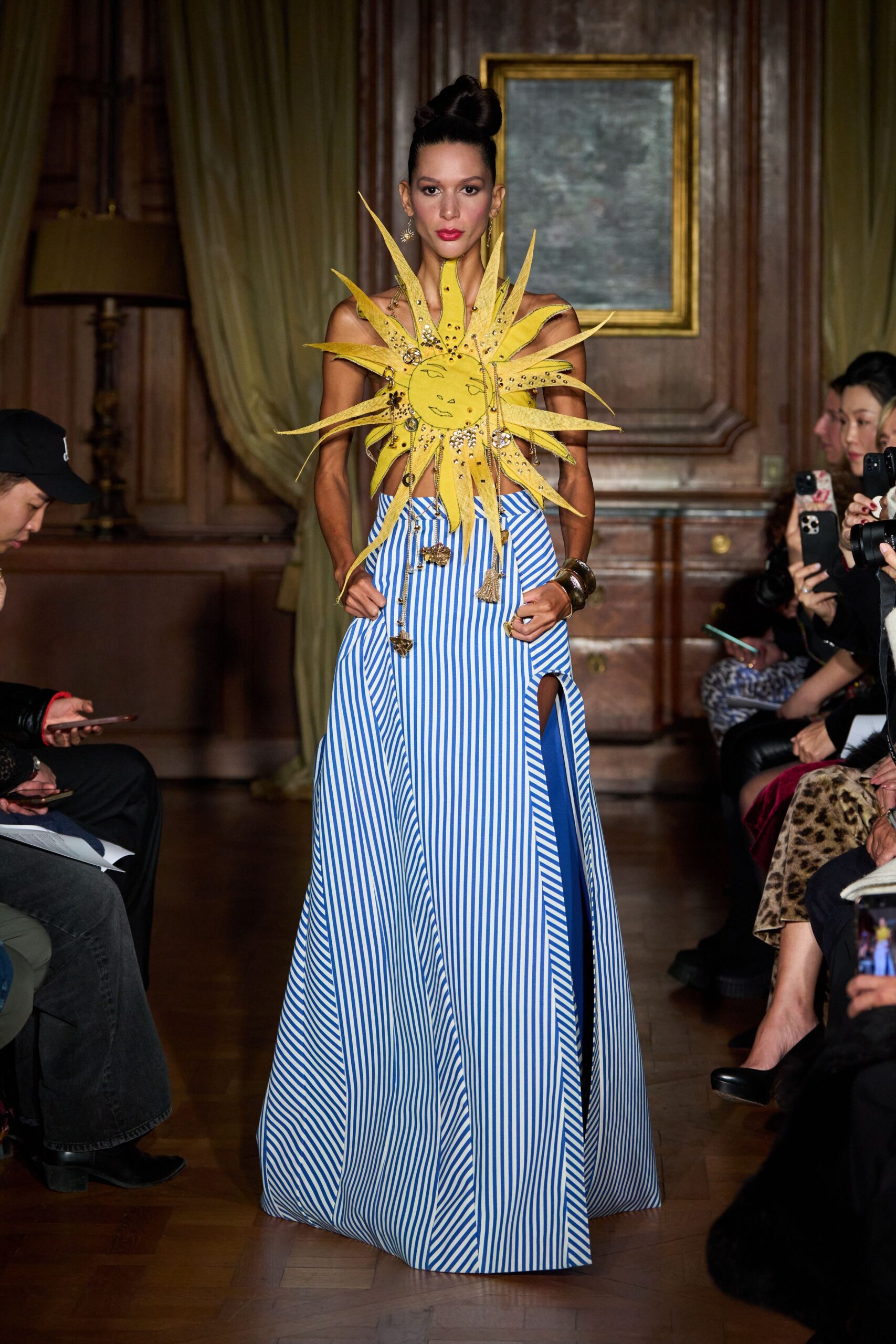 blue and white striped gown with yellow accessory