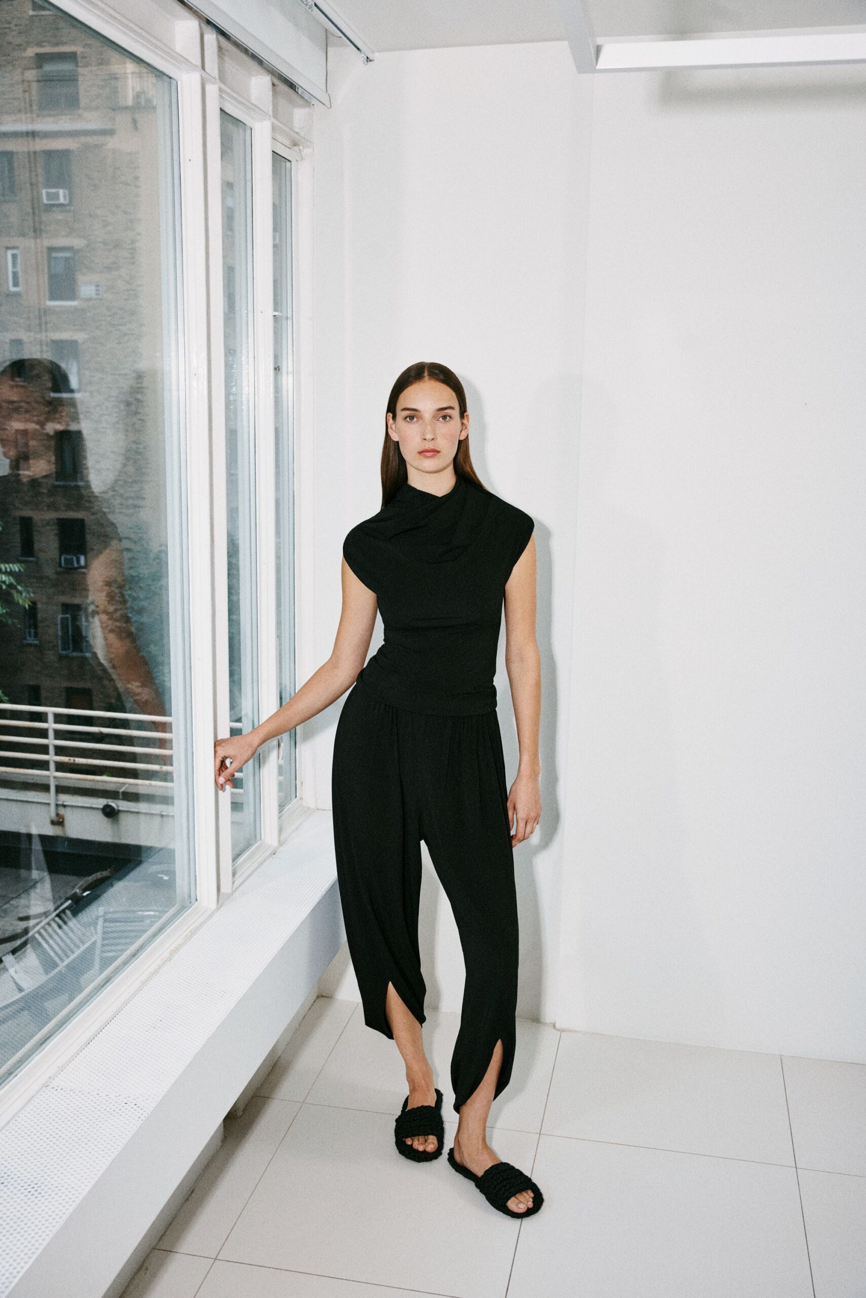 black fitted top and relaxed pants