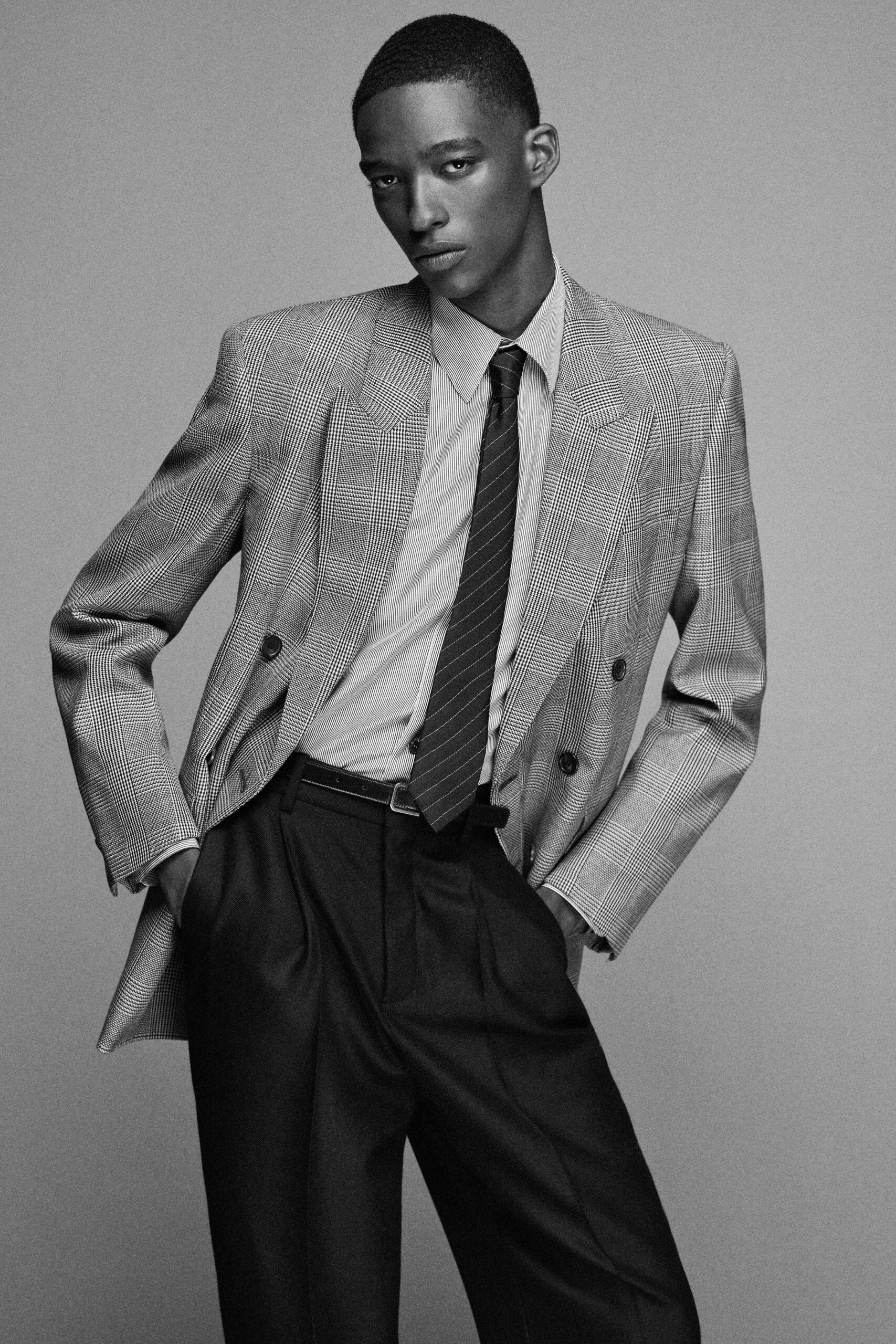 gray tailored blazer with black pants