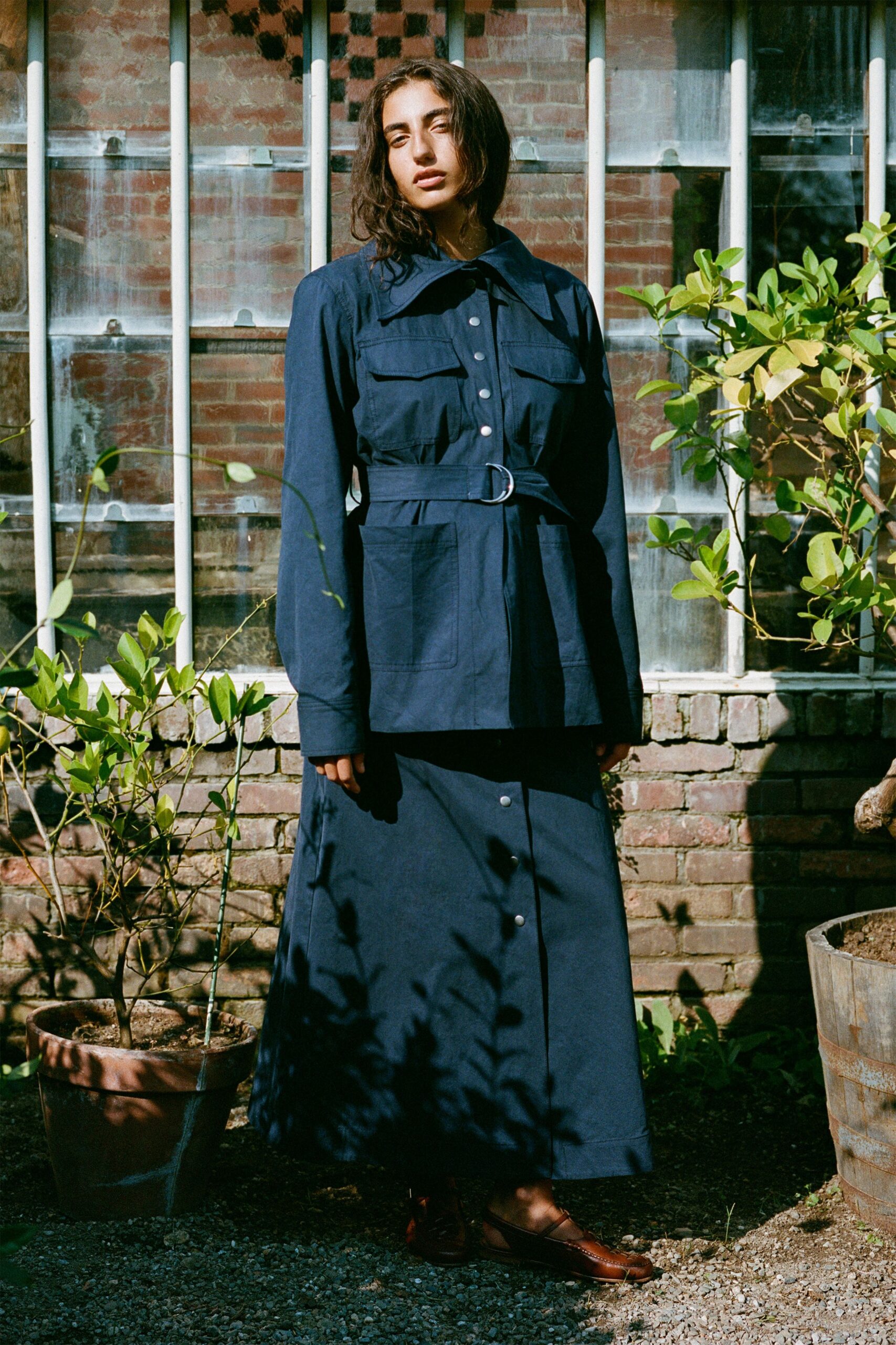 blue cotton long-sleeve collared relaxed buttoned pockets top